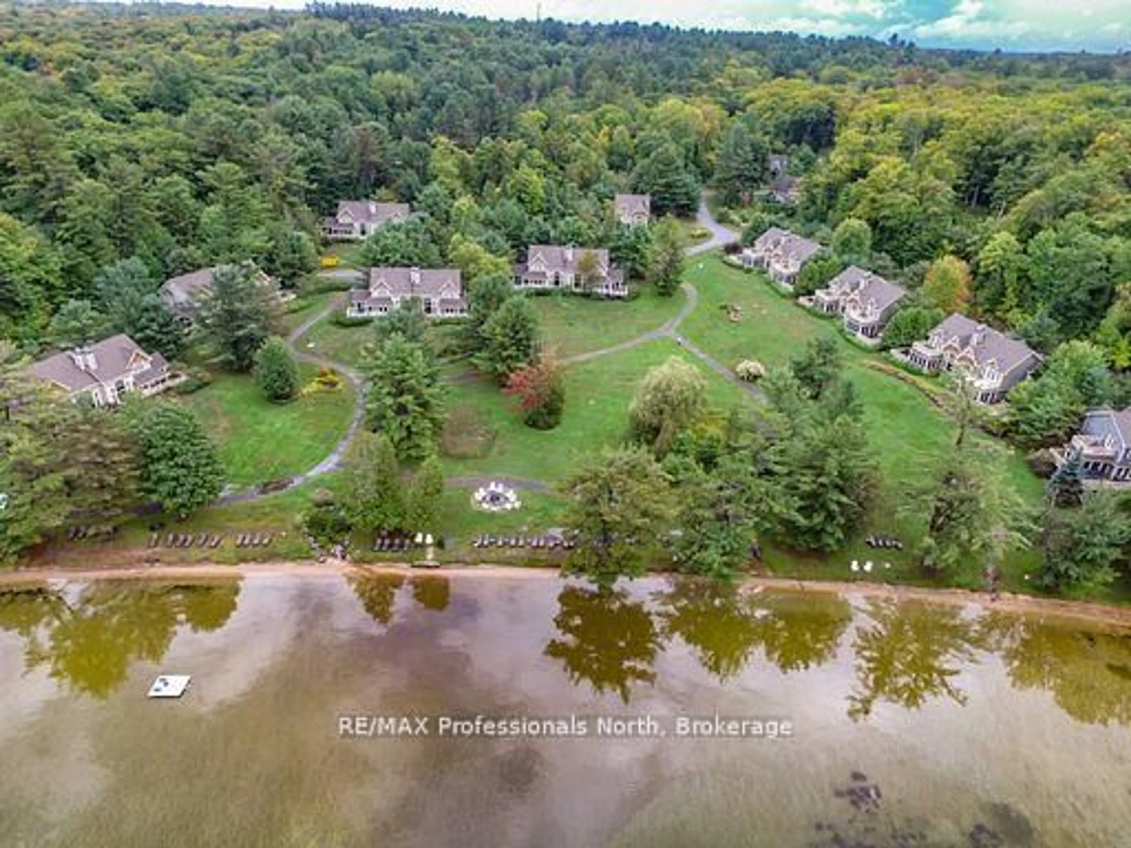 A pic from outside/outdoor area/front of a property/back of a property/a pic from drone, water/lake/river/ocean view for 3876 MUSKOKA ROAD 118 #Sandfield 2, Week 10, Muskoka Lakes Ontario P0B 1J0