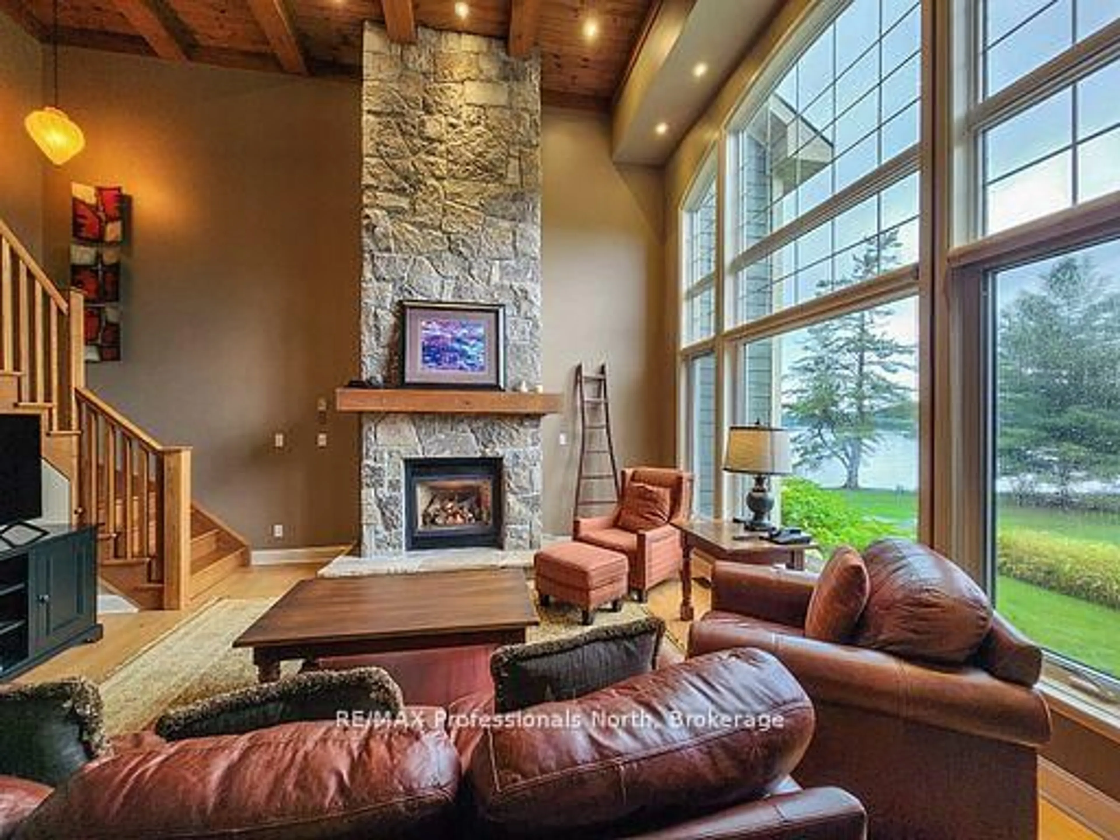 Living room with furniture, unknown for 3876 MUSKOKA ROAD 118 #Sandfield 2, Week 10, Muskoka Lakes Ontario P0B 1J0