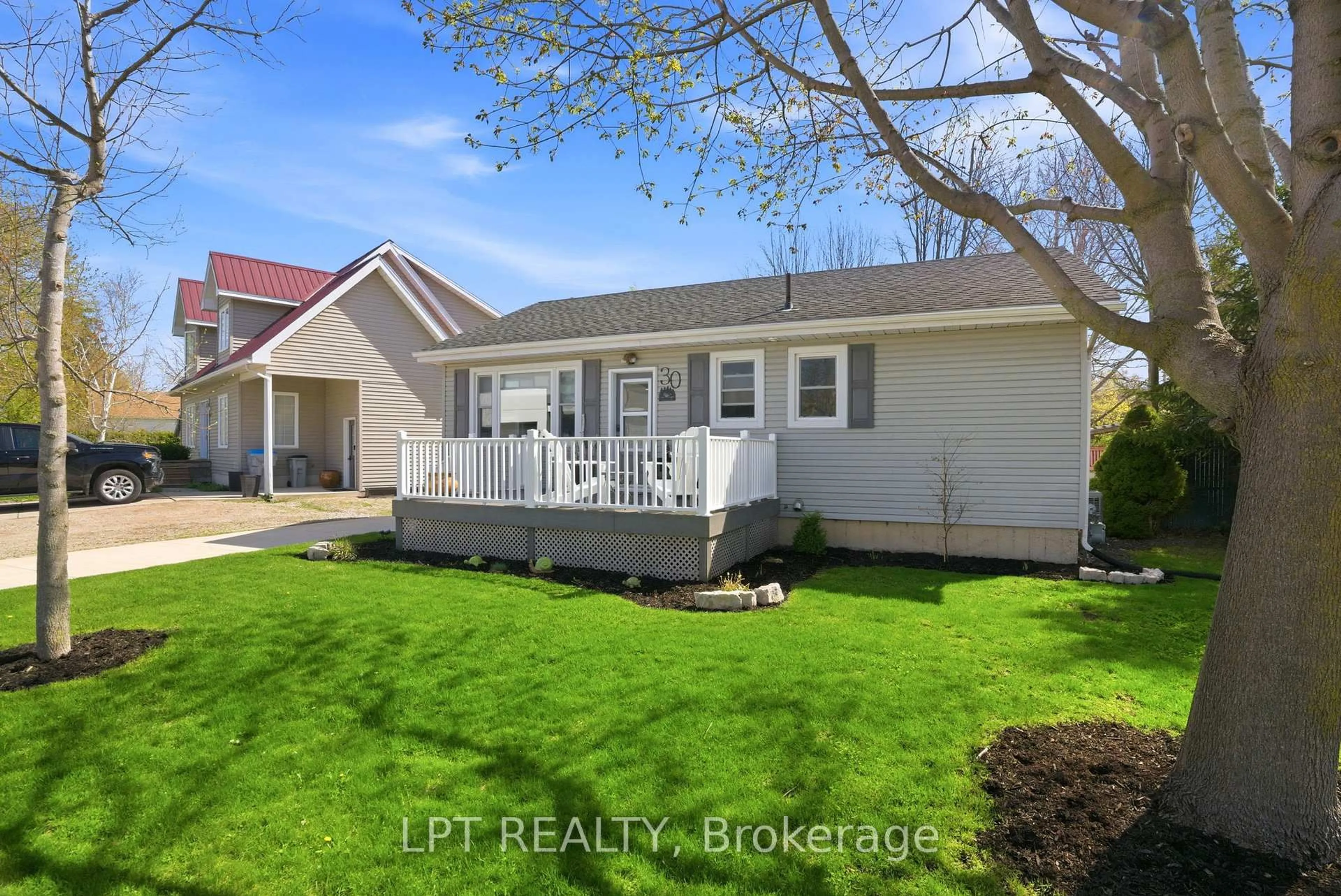 Home with vinyl exterior material, street for 30 Sauble River Rd, Lambton Shores Ontario N0M 1T0