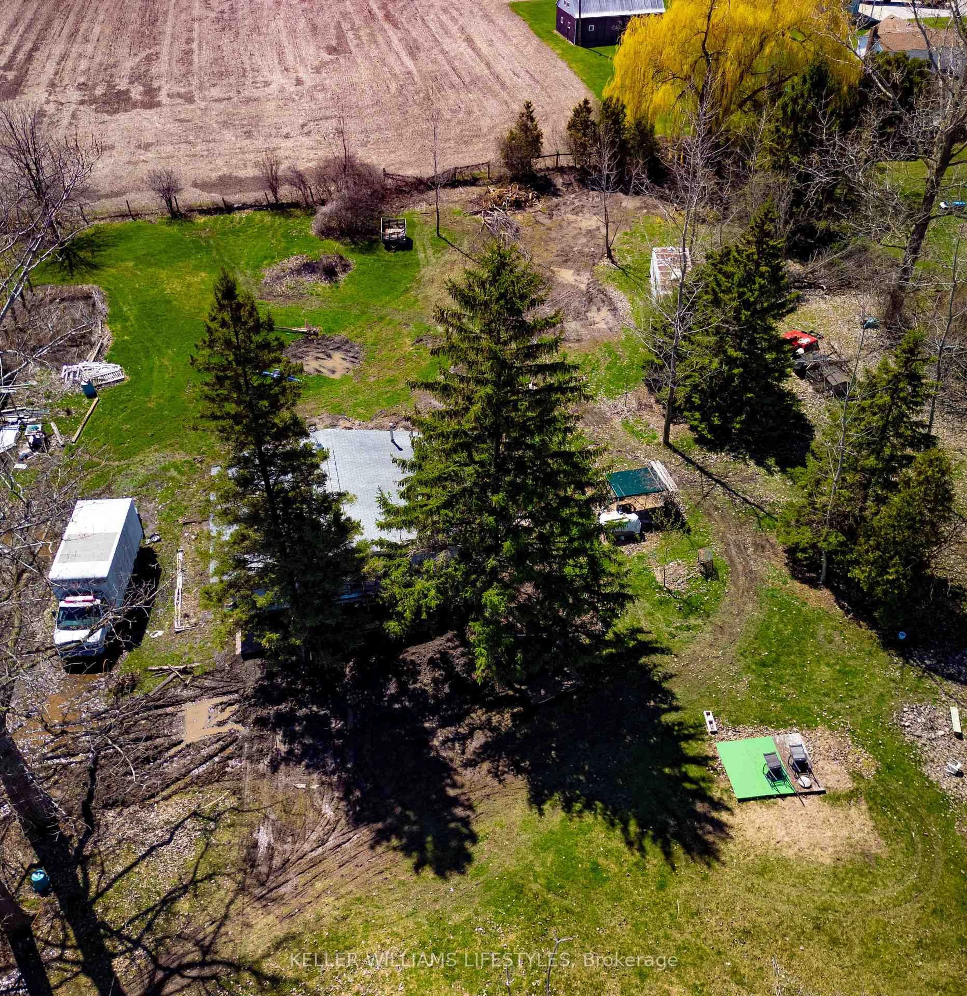 A pic from outside/outdoor area/front of a property/back of a property/a pic from drone, forest/trees view for 3319 London Line, Plympton-Wyoming Ontario N0N 1T0