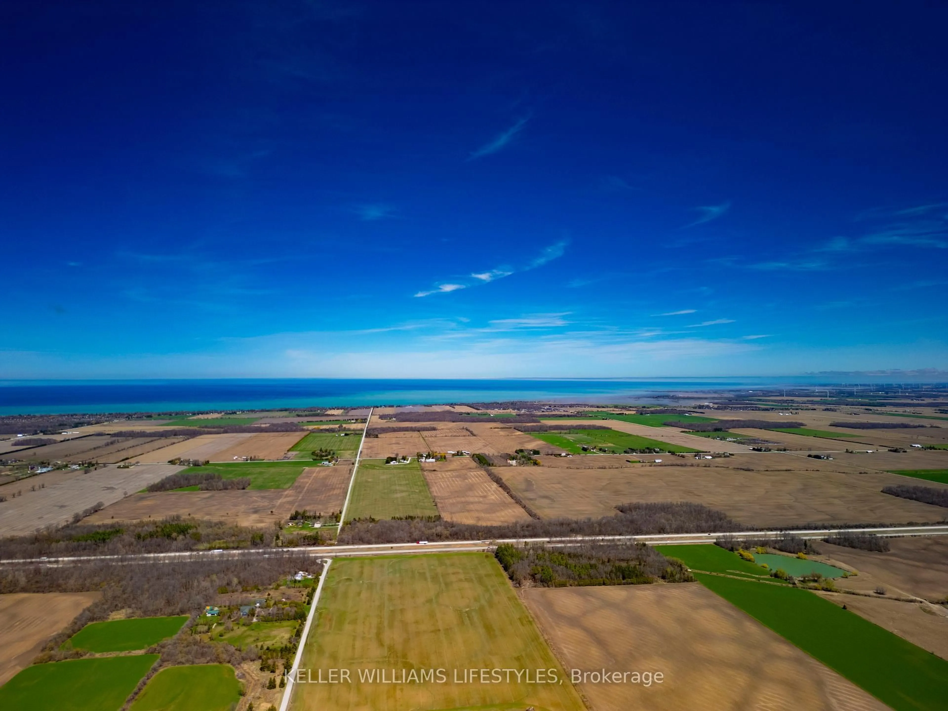 A pic from outside/outdoor area/front of a property/back of a property/a pic from drone, water/lake/river/ocean view for 3319 London Line, Plympton-Wyoming Ontario N0N 1T0