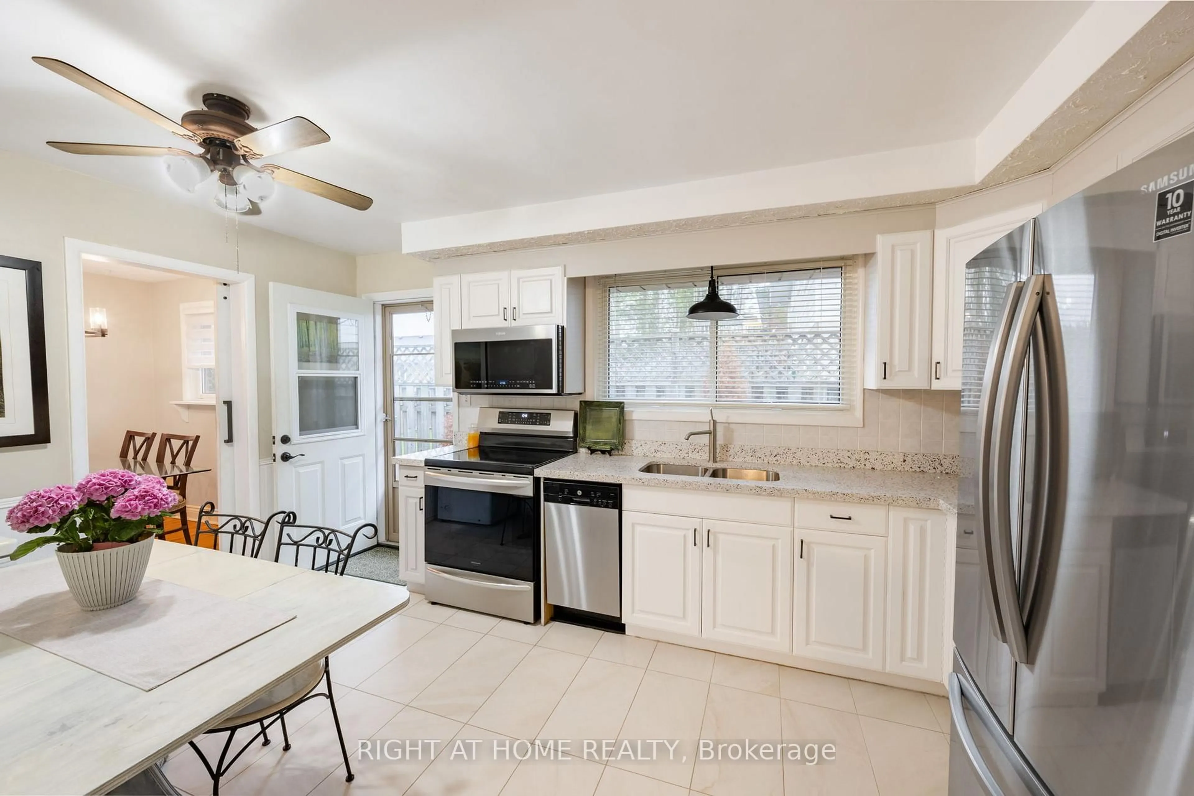 Open concept kitchen, ceramic/tile floor for 323 Lindan Ave, Selwyn Ontario K9L 1K9