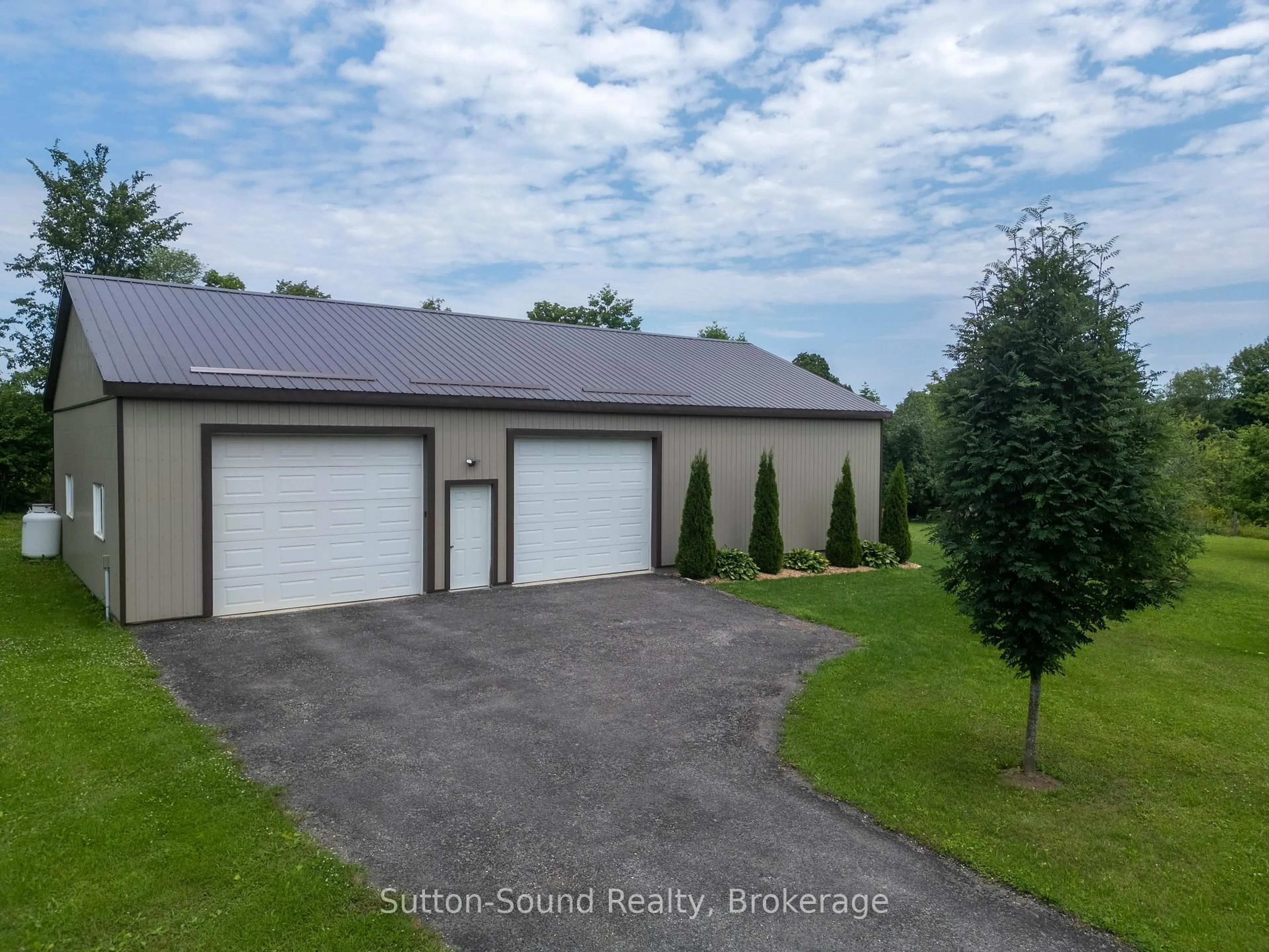 A pic from outside/outdoor area/front of a property/back of a property/a pic from drone, street for 442513 21 Concession, Georgian Bluffs Ontario N0H 2T0