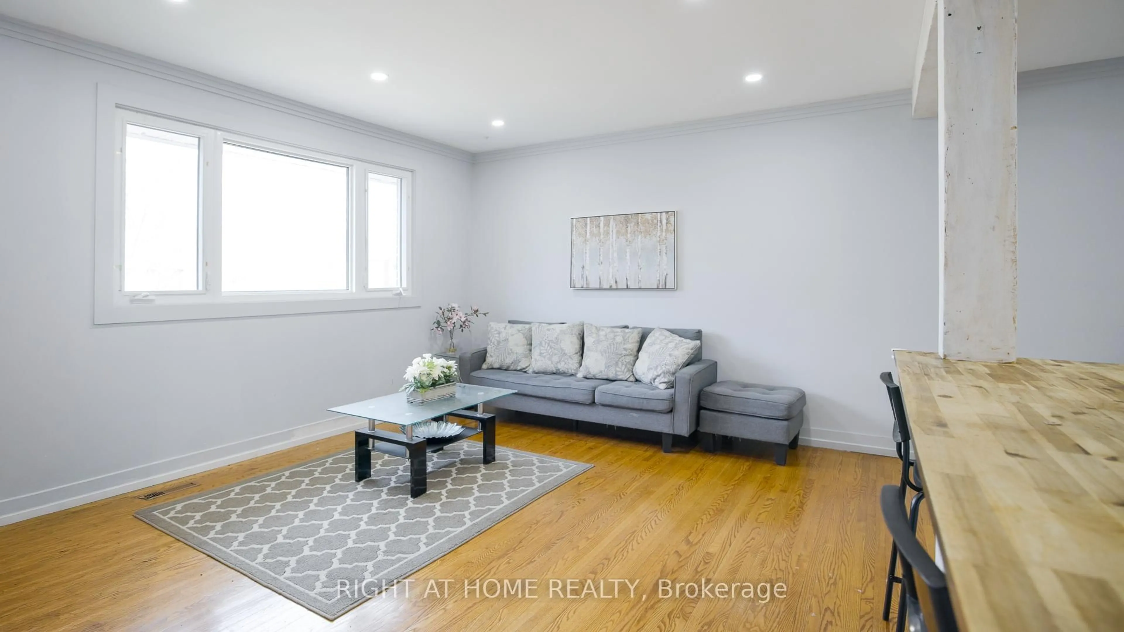 Living room with furniture, wood/laminate floor for 134 David Dr, Ottawa Ontario K2G 2N9