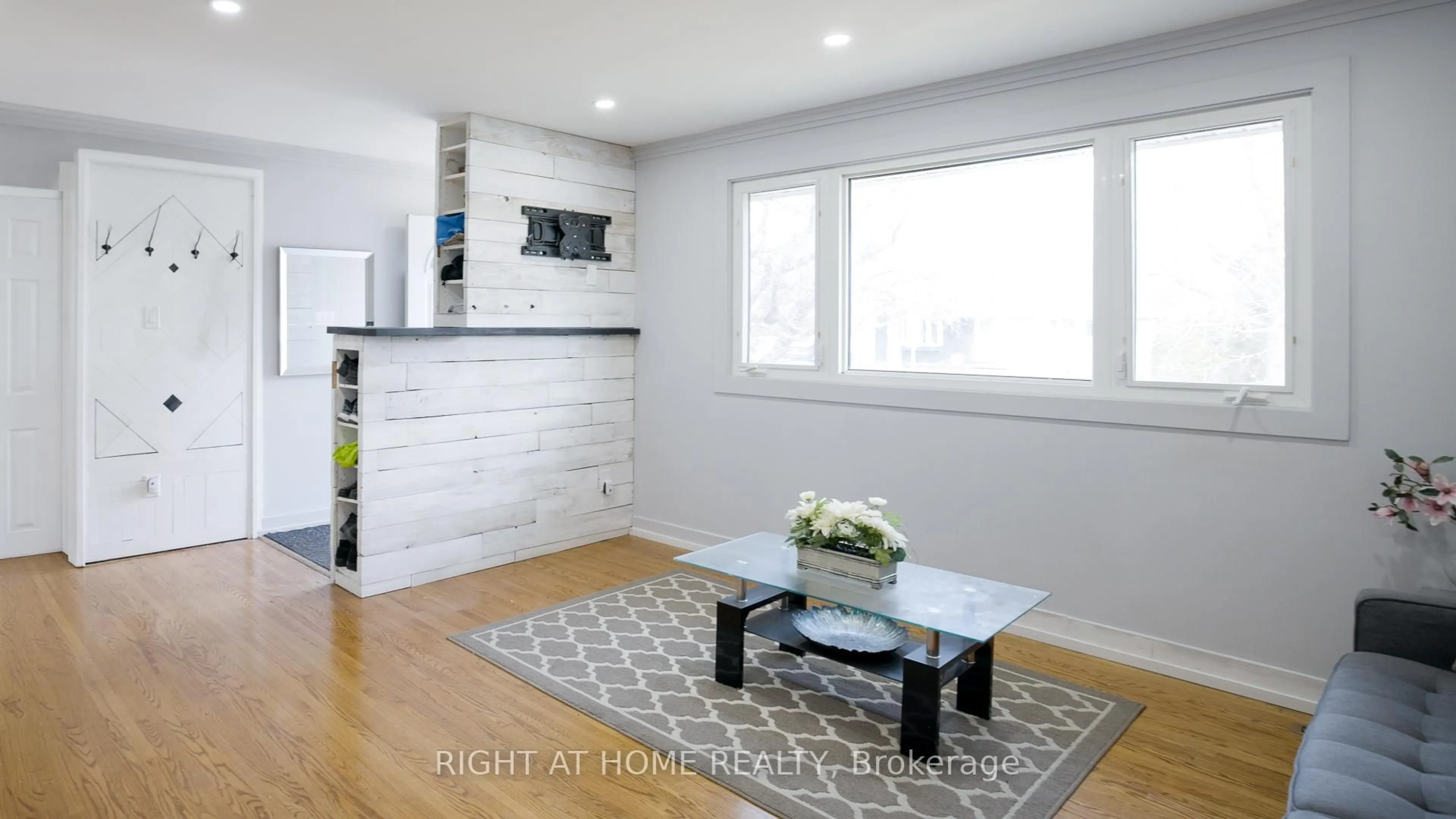 Living room with furniture, wood/laminate floor for 134 David Dr, Ottawa Ontario K2G 2N9