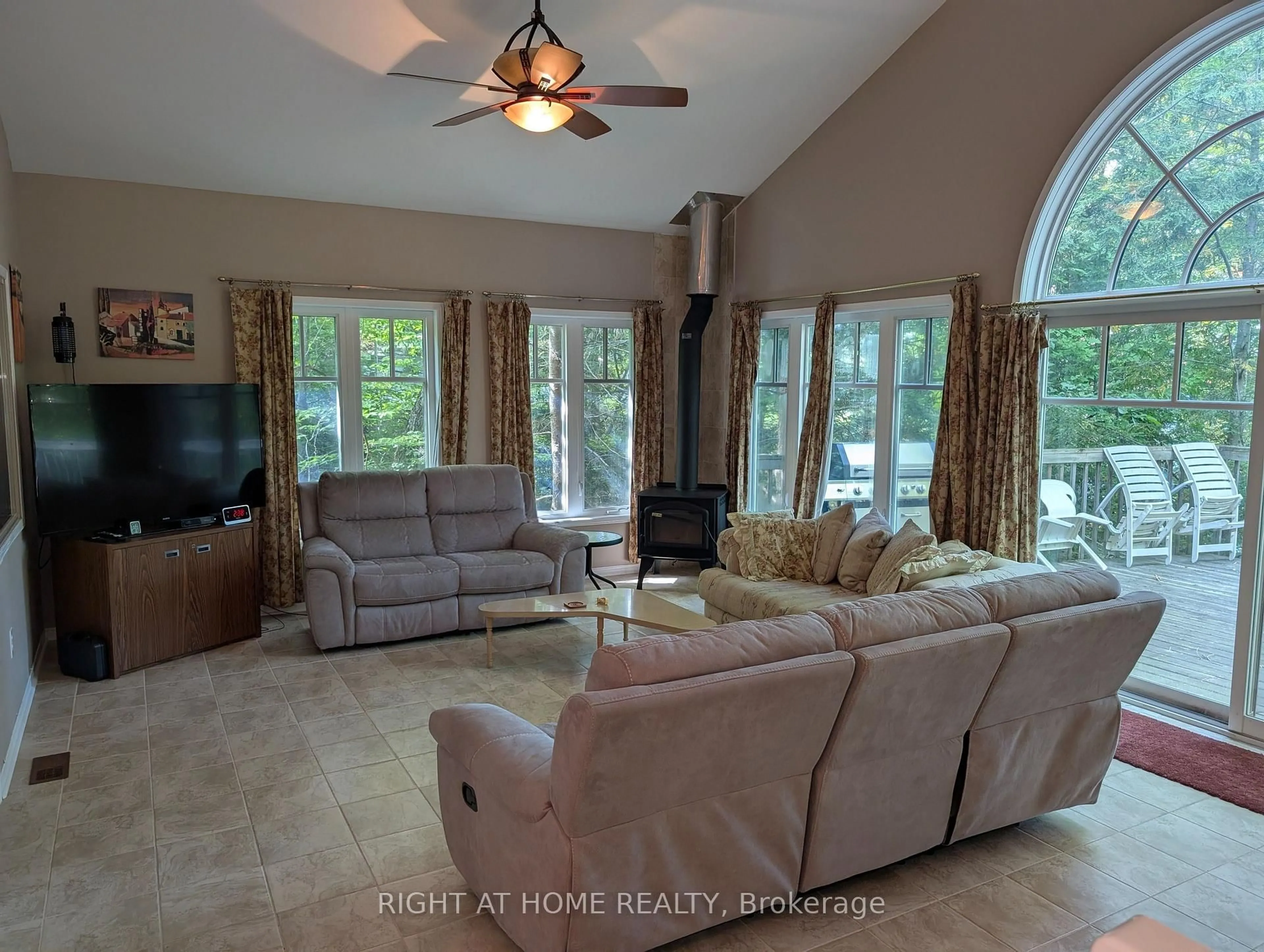 Living room with furniture, ceramic/tile floor for 1073 Joshs Bay Rd, Muskoka Lakes Ontario P0B 1M0