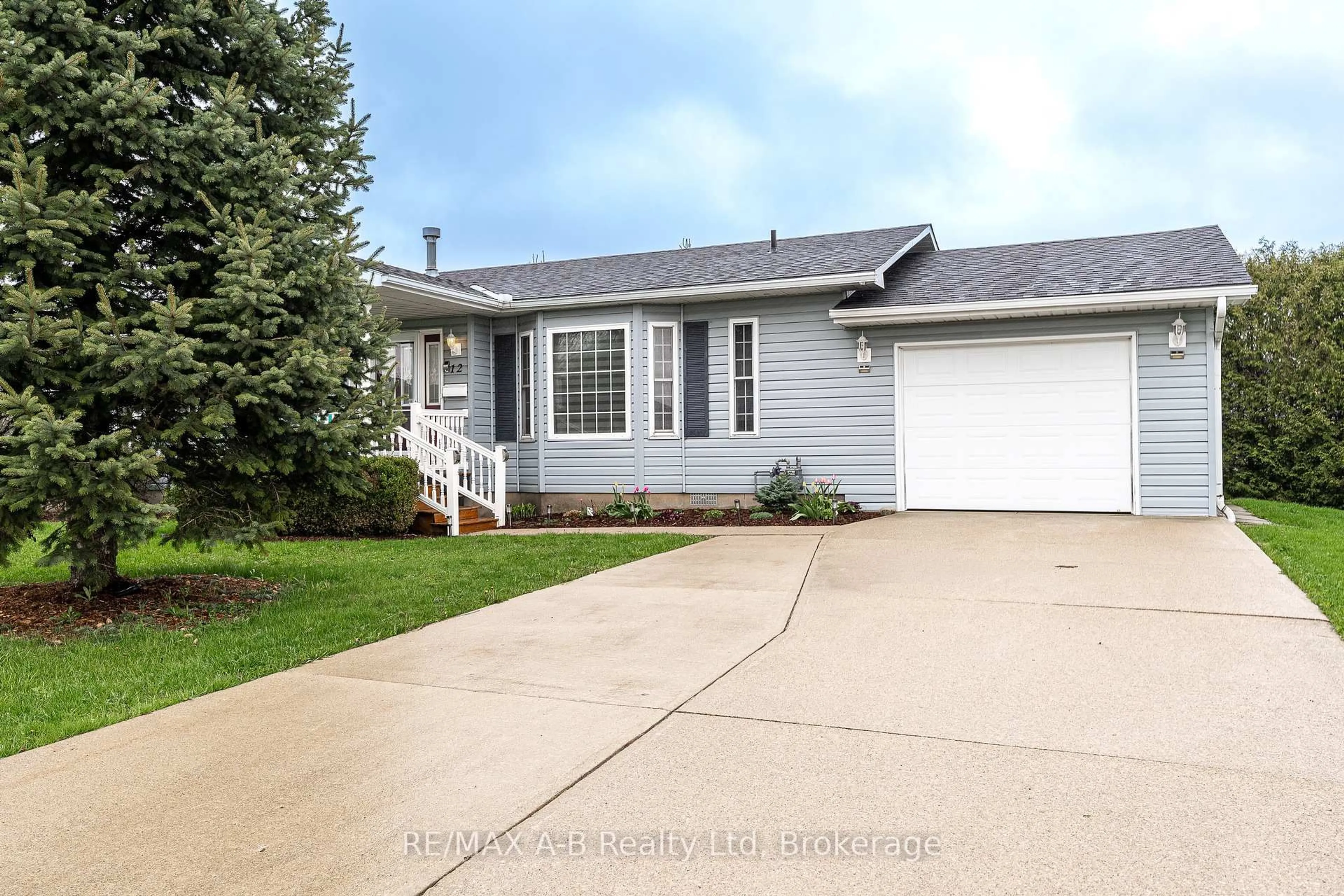 Home with vinyl exterior material, street for 30 Ann St #12, St. Marys Ontario N4X 1C8