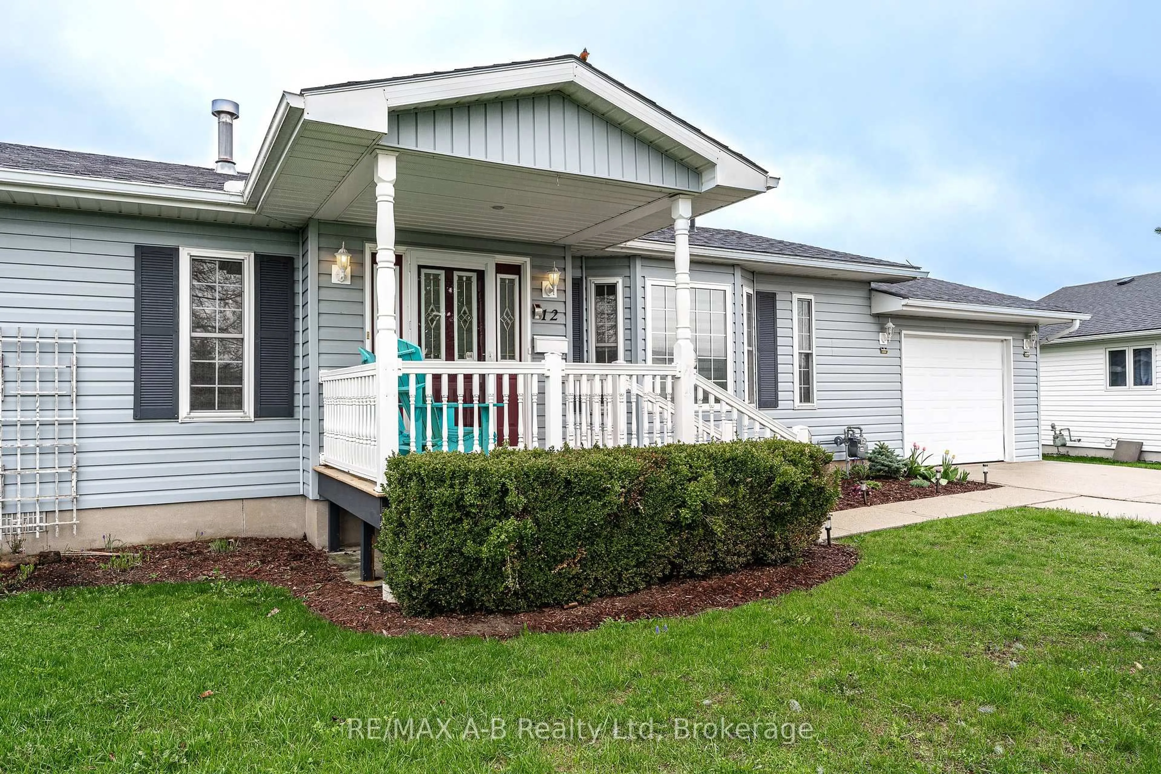 Home with vinyl exterior material, street for 30 Ann St #12, St. Marys Ontario N4X 1C8