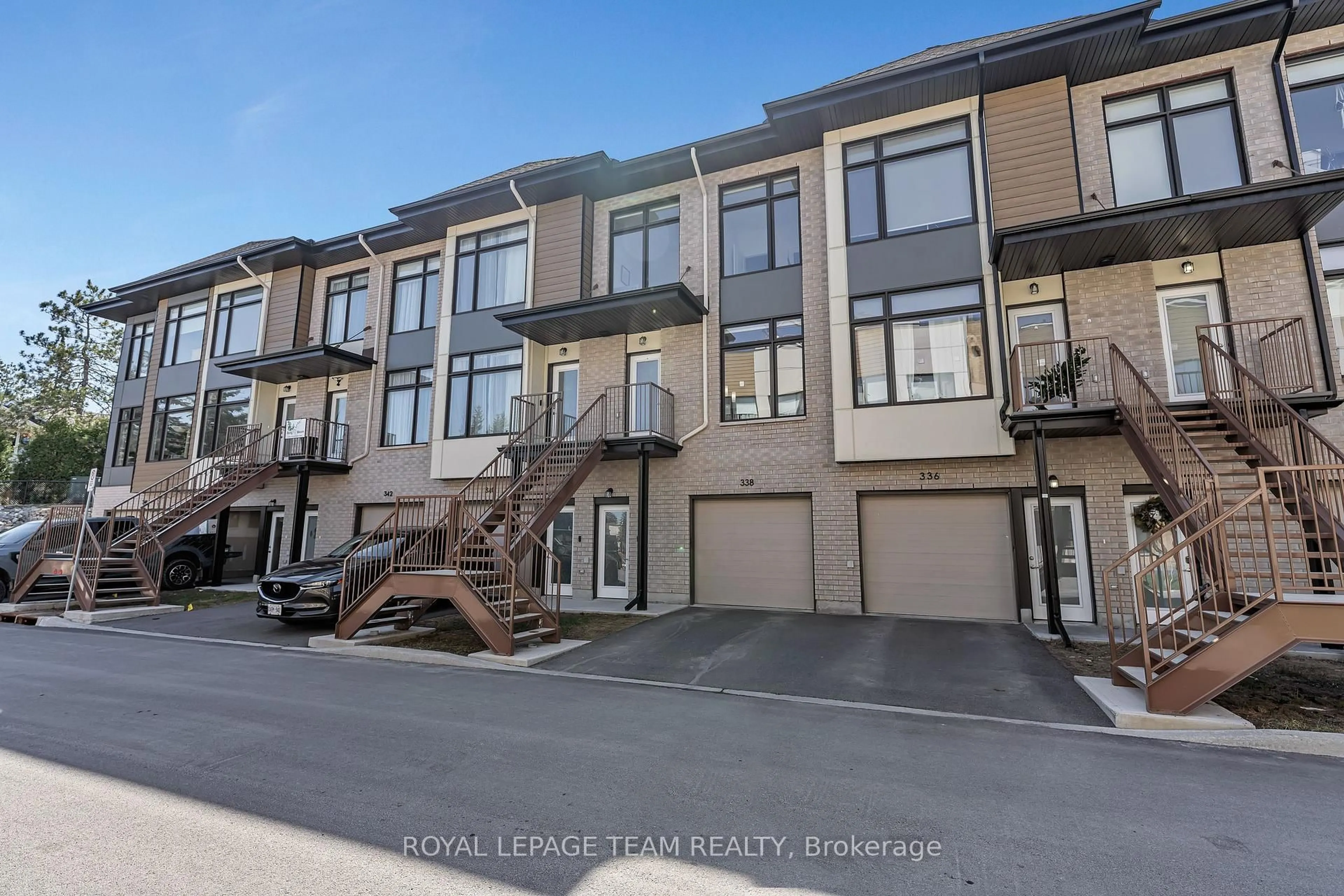 A pic from outside/outdoor area/front of a property/back of a property/a pic from drone, street for 338 Foliage Private, Ottawa Ontario K2H 0C5