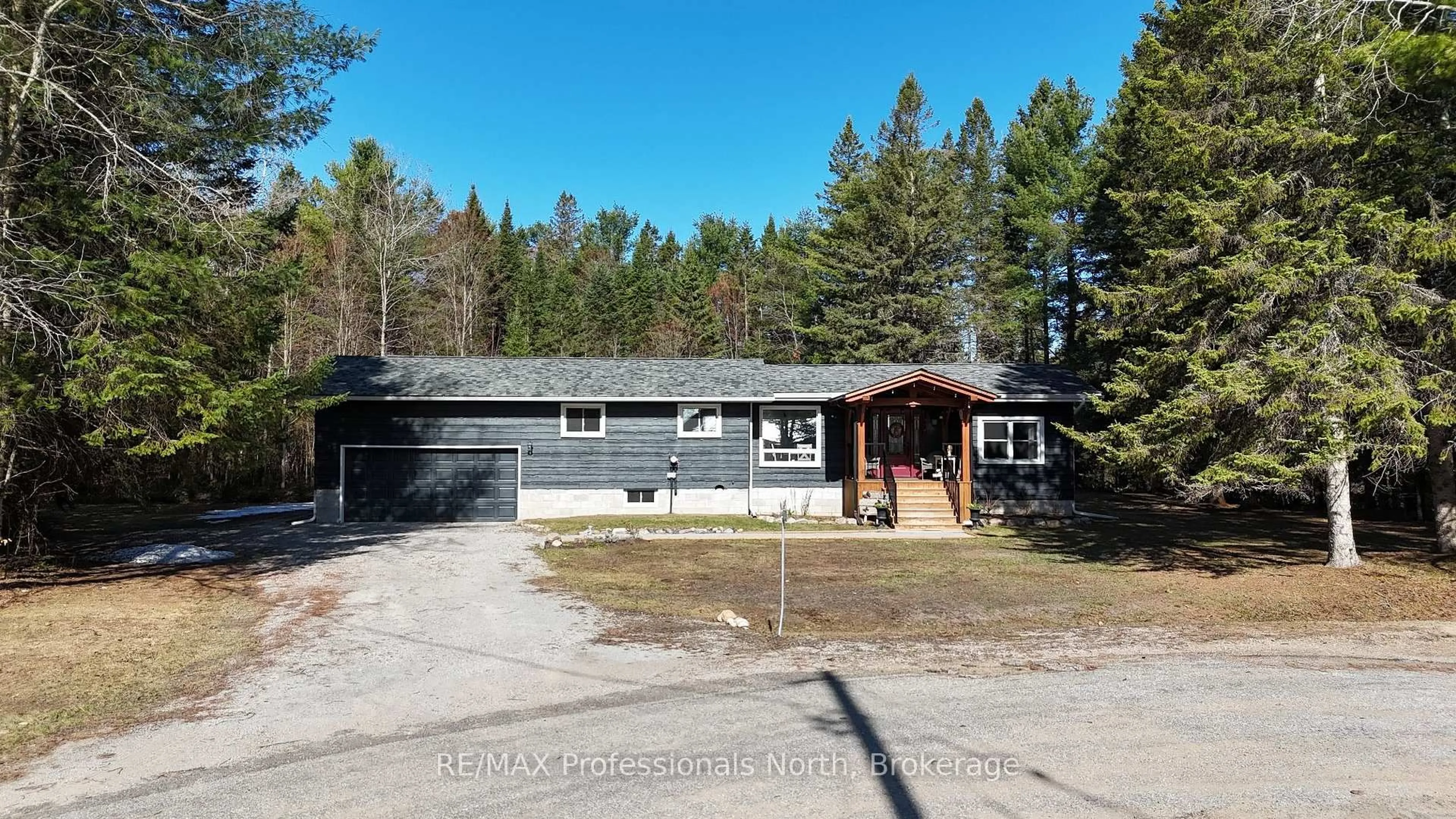 A pic from outside/outdoor area/front of a property/back of a property/a pic from drone, street for 1041 Winding Creek Rd, Minden Hills Ontario K0M 2K0