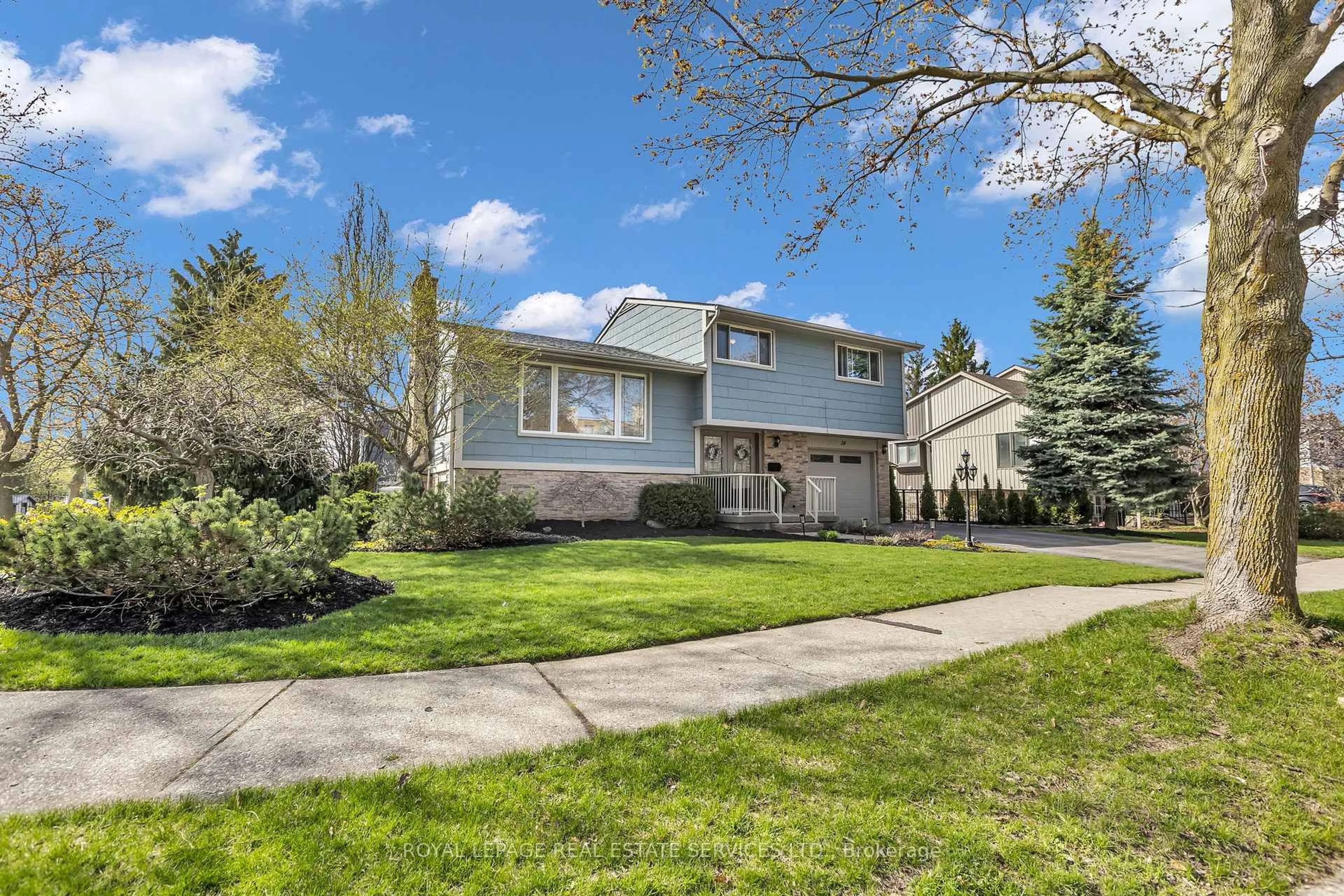 Home with vinyl exterior material, street for 24 Shuh Ave, Kitchener Ontario N2A 2X9