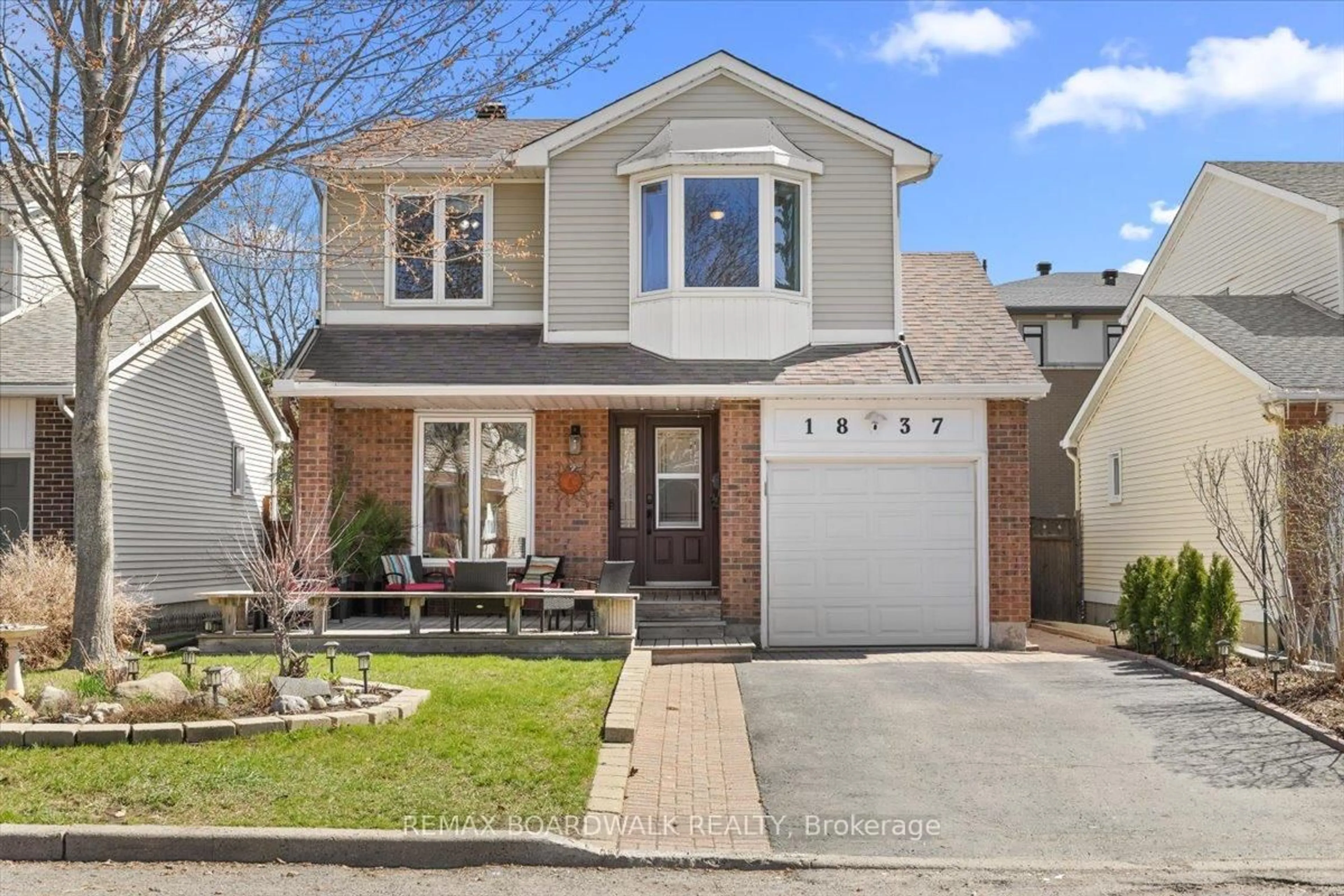 Home with vinyl exterior material, street for 1837 Windflower Way, Orleans Ontario K1C 5Z8