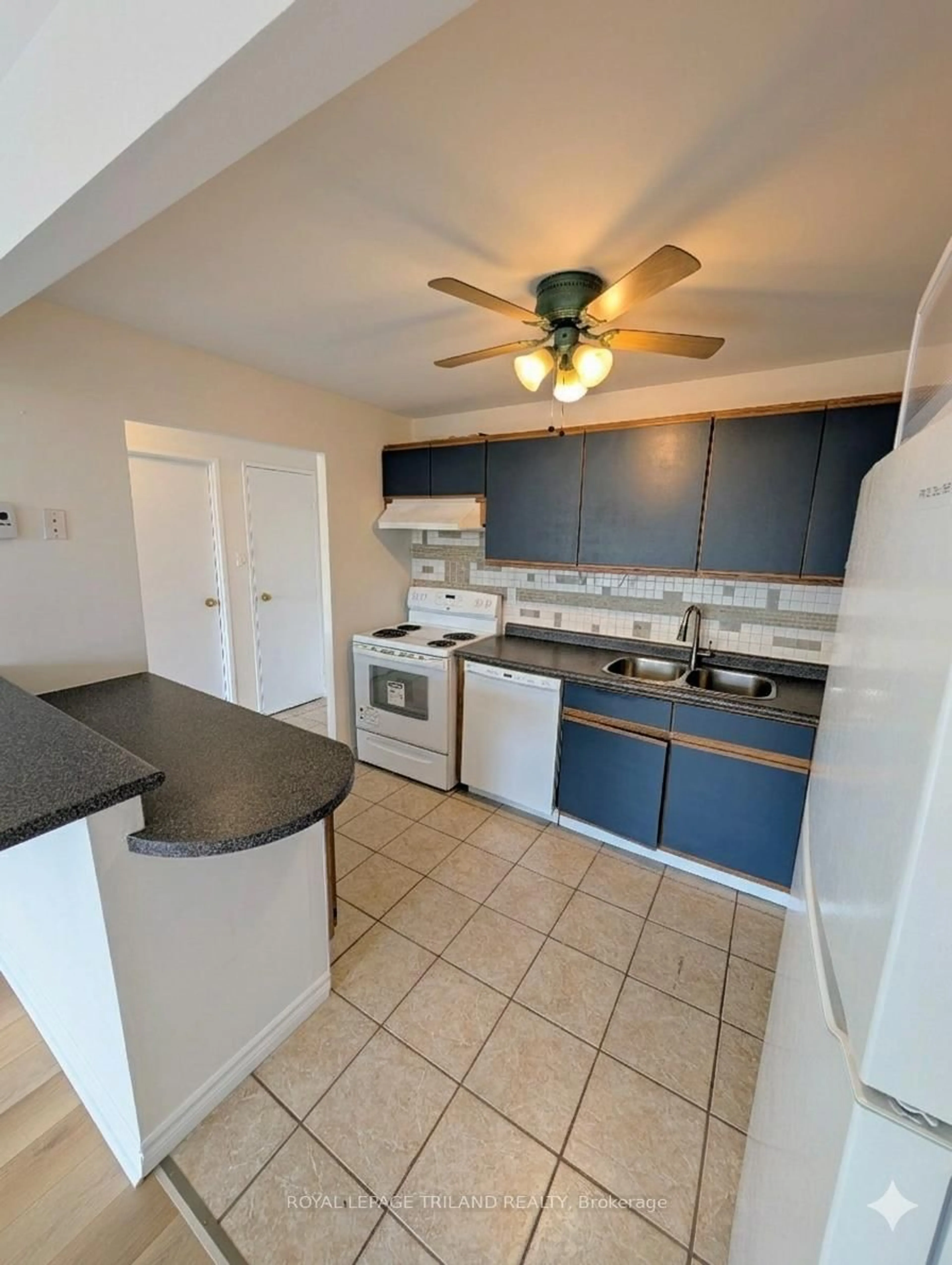 Standard kitchen, ceramic/tile floor for 135 Base Line Rd #306, London South Ontario N6J 4W4