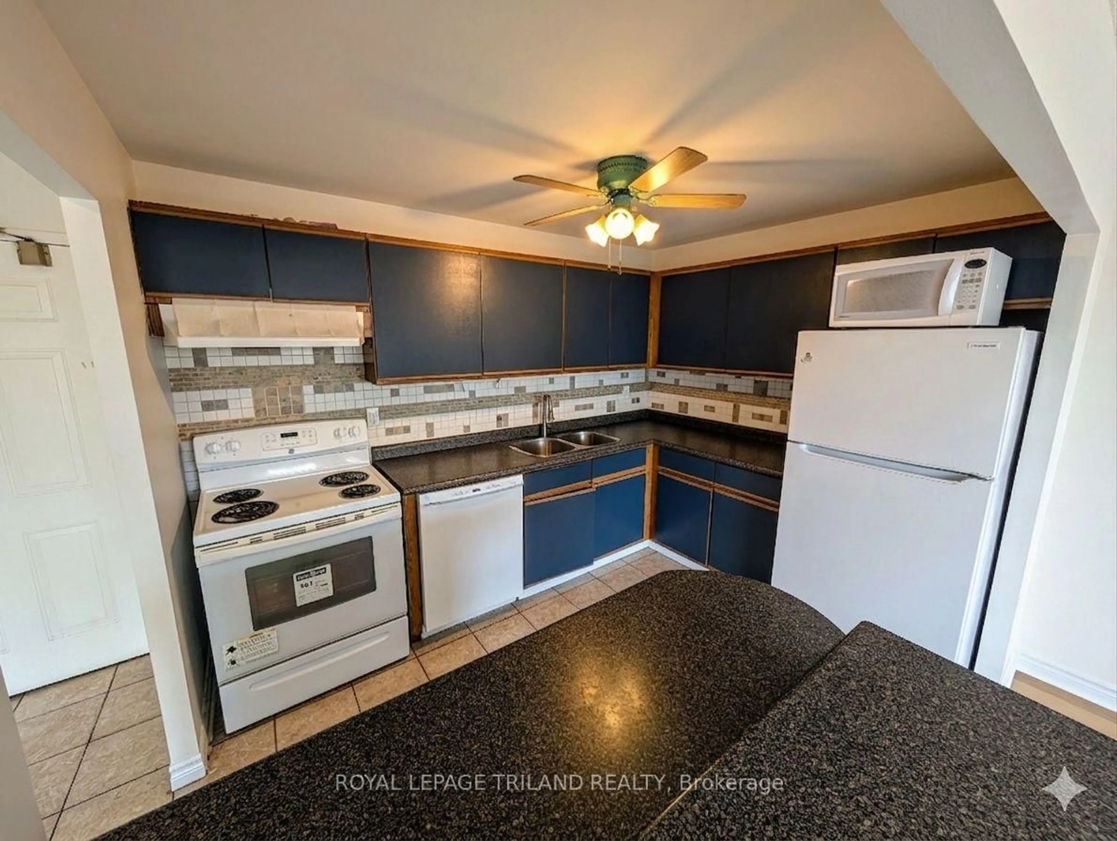 Standard kitchen, ceramic/tile floor for 135 Base Line Rd #306, London South Ontario N6J 4W4