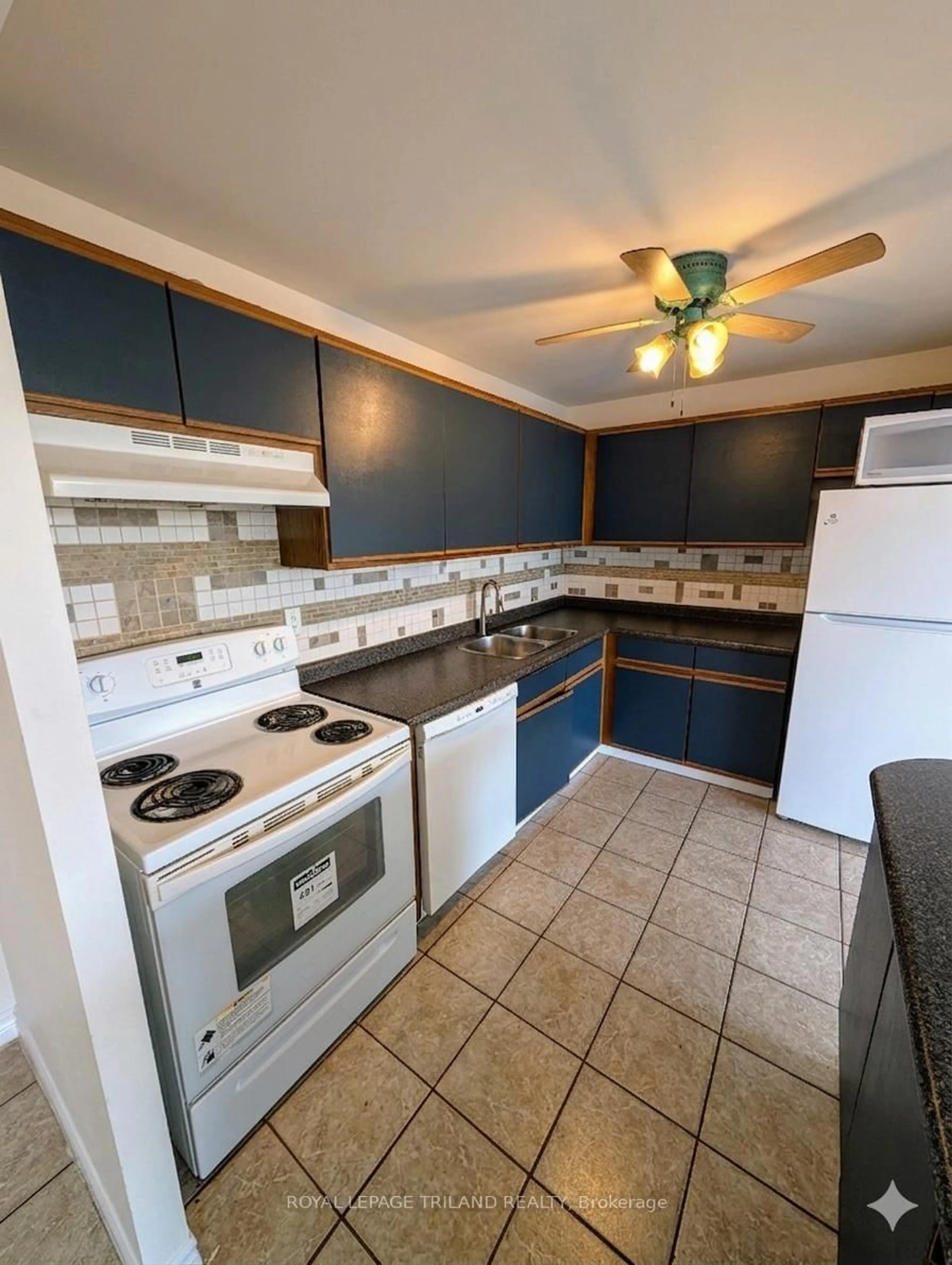 Standard kitchen, ceramic/tile floor for 135 Base Line Rd #306, London South Ontario N6J 4W4