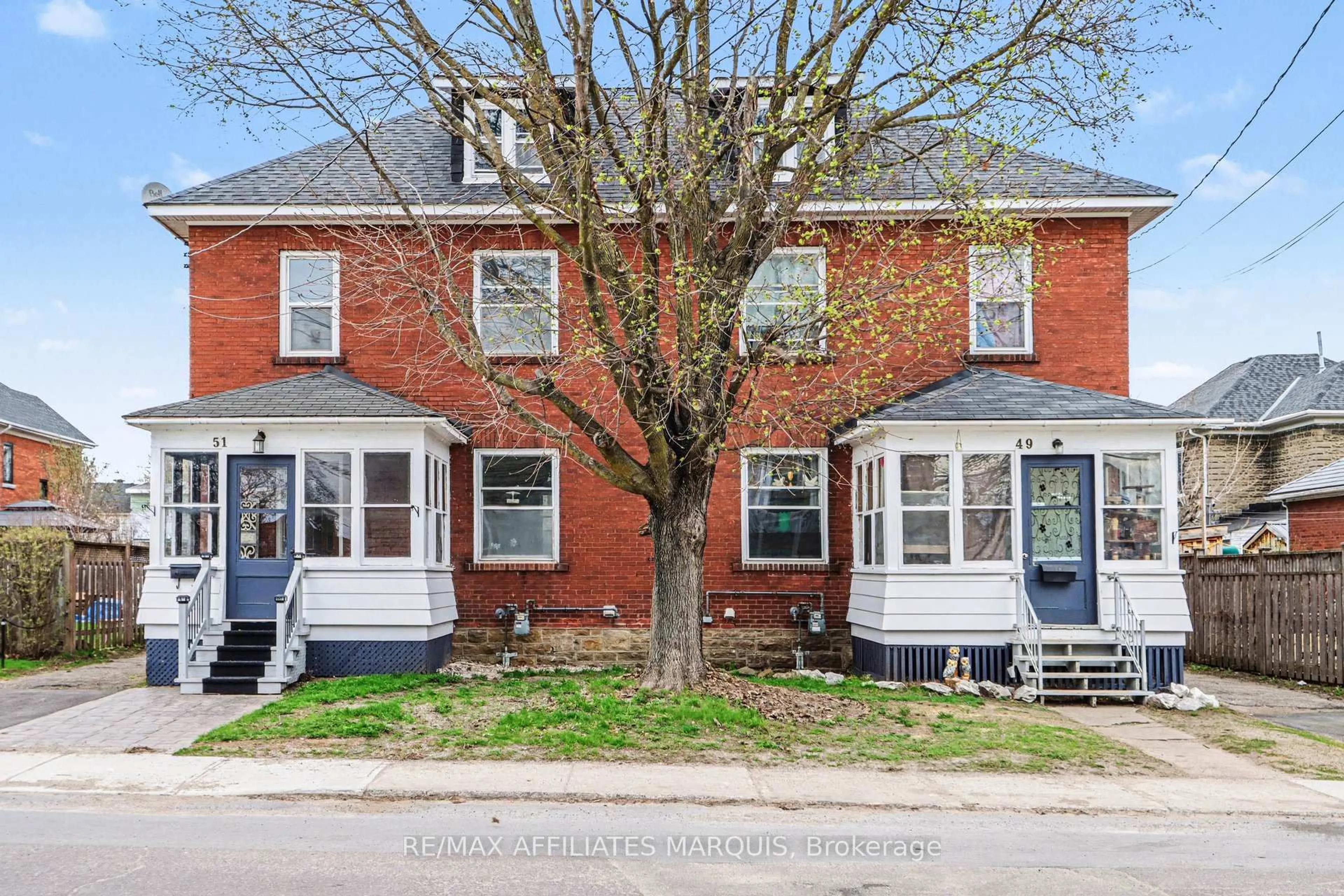 Home with brick exterior material, street for 49-51 McGill St, Smiths Falls Ontario K7A 2J7