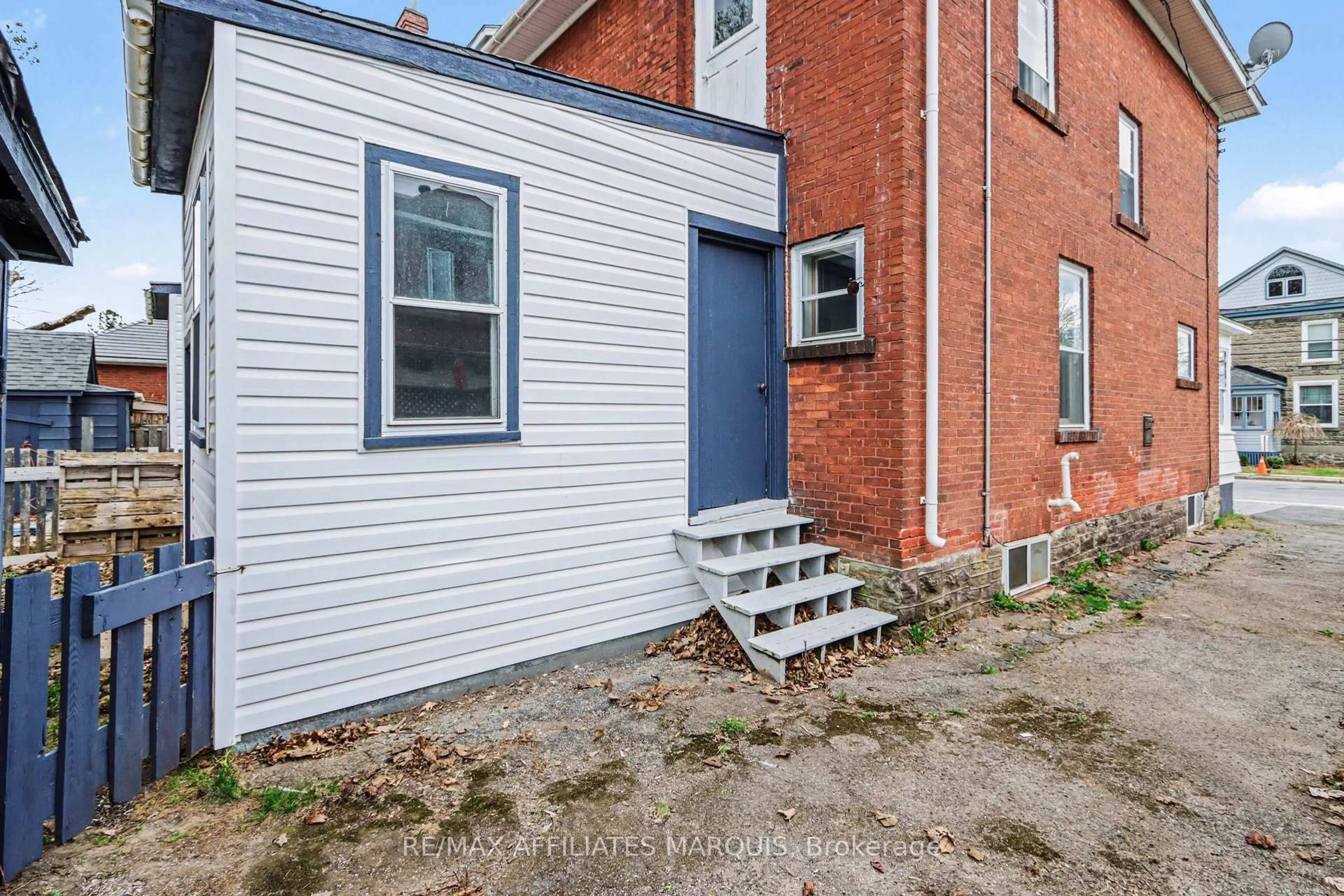 Home with brick exterior material, street for 49-51 McGill St, Smiths Falls Ontario K7A 2J7