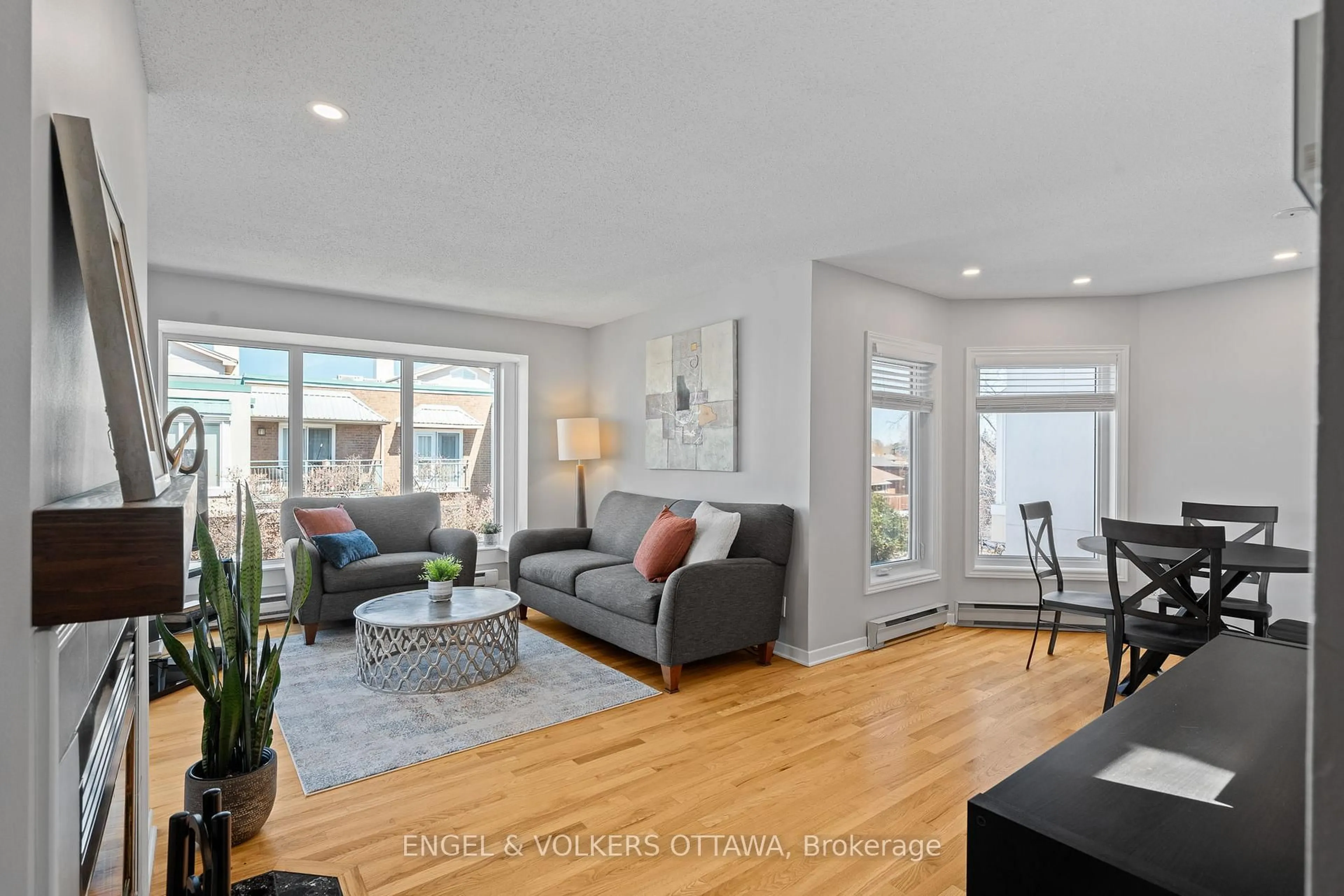 Living room with furniture, wood/laminate floor for 1 Columbus Ave #403D, Ottawa Ontario K1K 4L1
