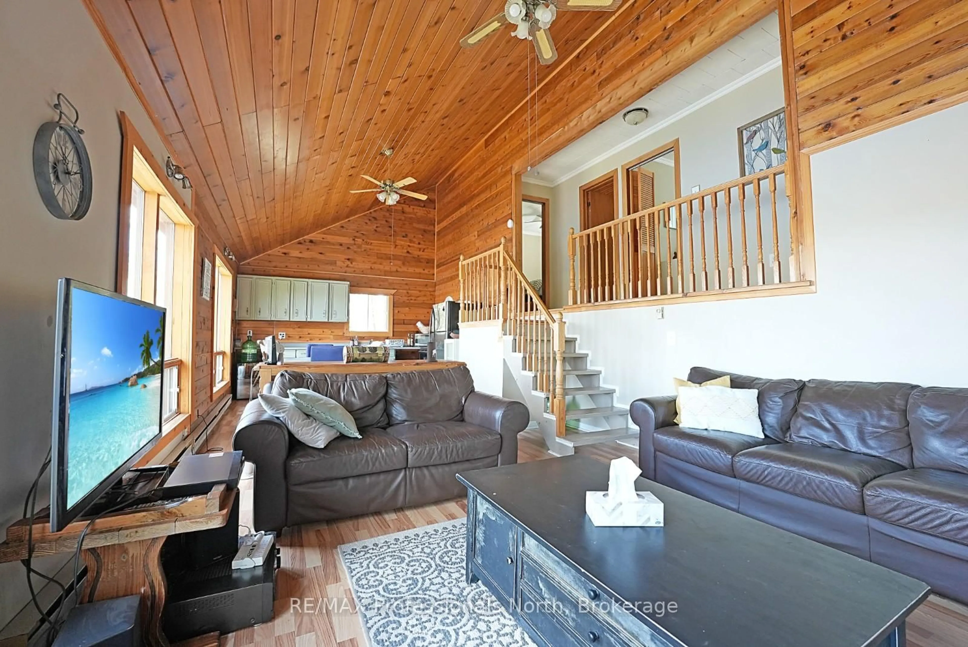 Living room with furniture, wood/laminate floor for 1017 Dunn Rd, Dysart et al Ontario K0M 1S0