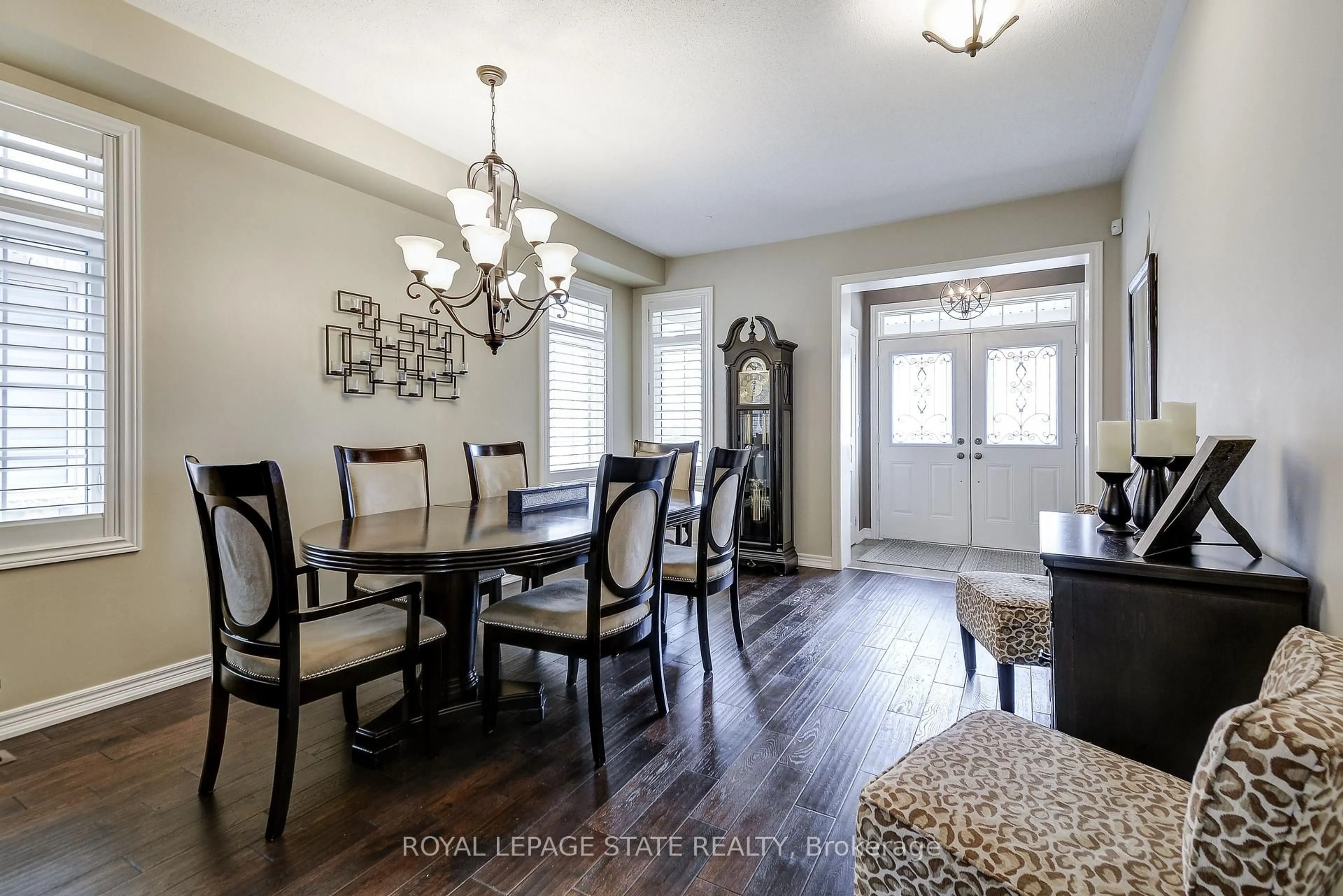 Dining room, wood/laminate floor for 23 McKnight Ave, Hamilton Ontario L8B 0R5
