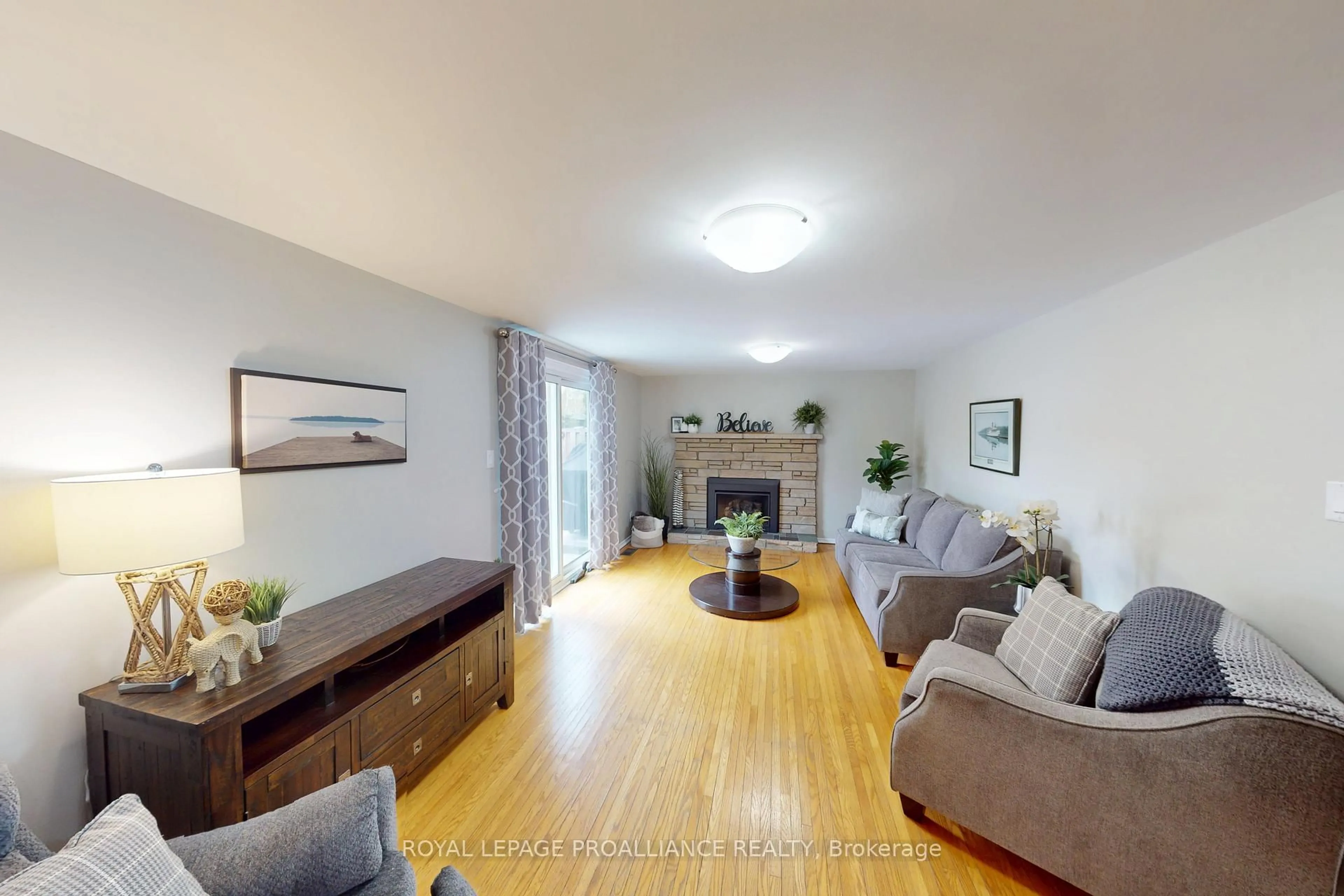 Living room with furniture, wood/laminate floor for 6 Richmond Grve, Belleville Ontario K8N 1Z1