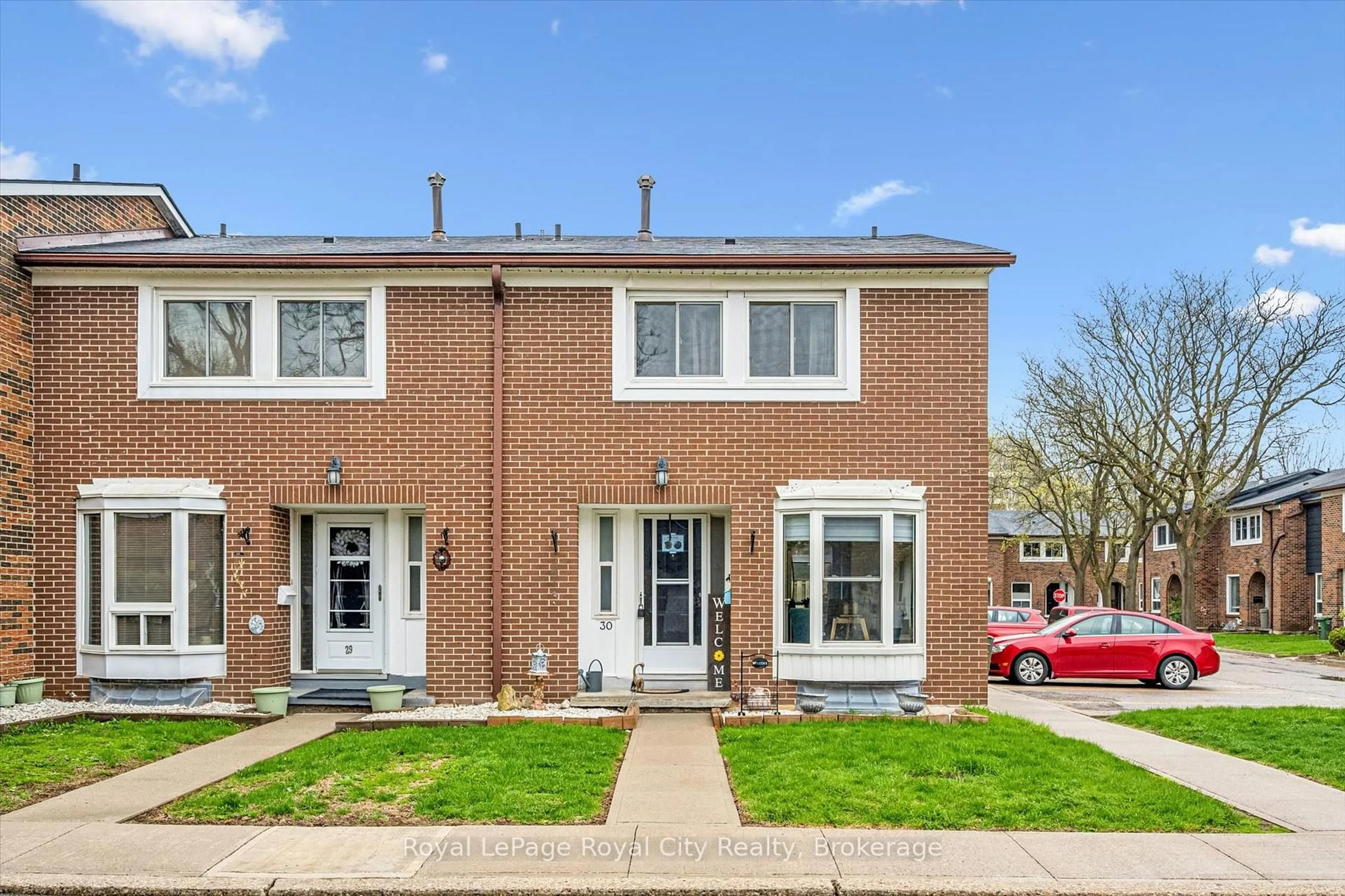 Home with brick exterior material, street for 121 Bagot St #30, Guelph Ontario N1H 5T8