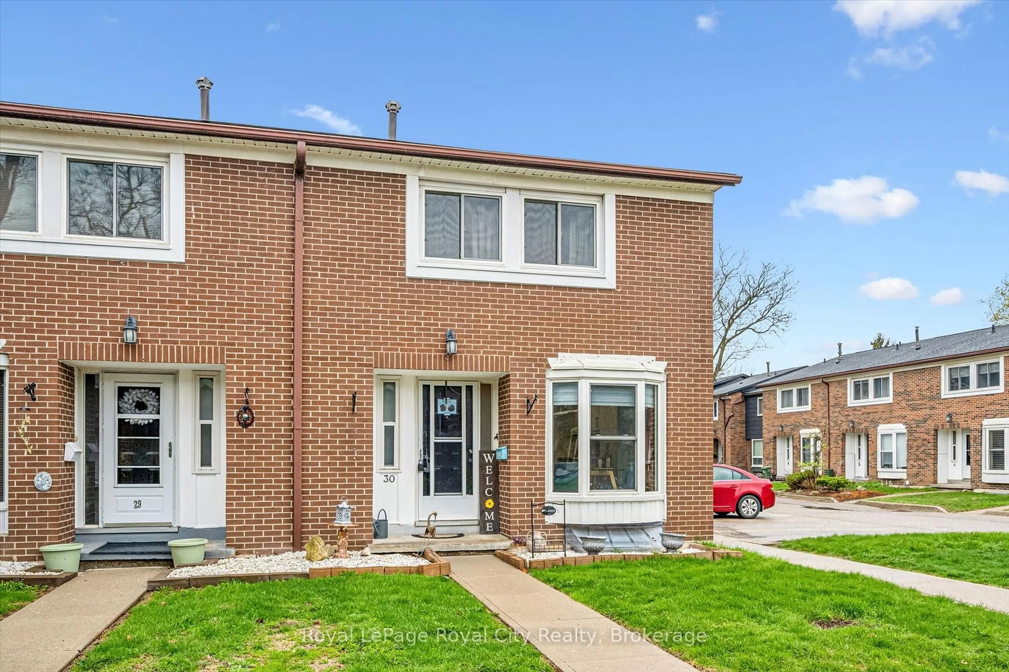 Home with brick exterior material, street for 121 Bagot St #30, Guelph Ontario N1H 5T8