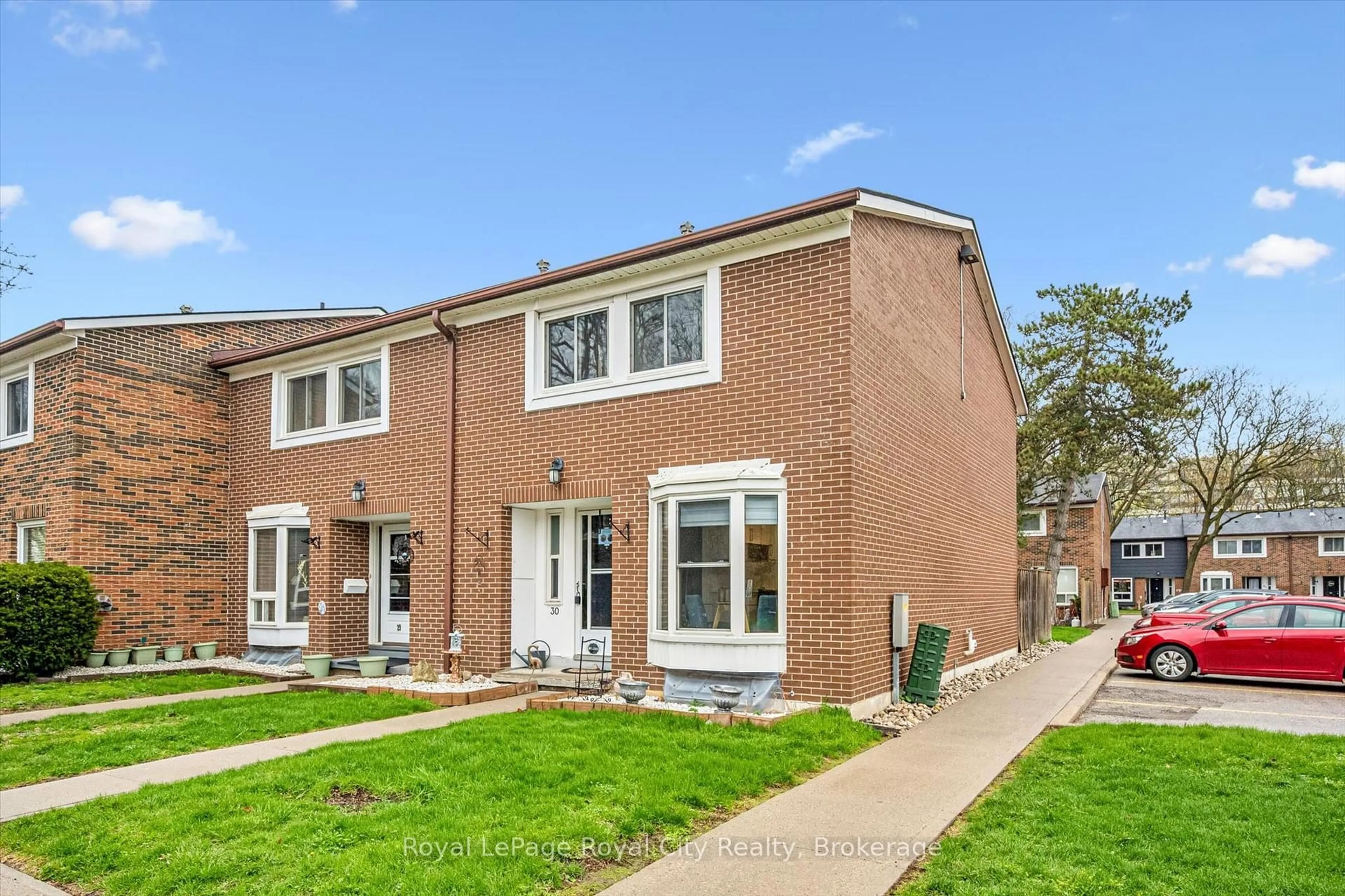 Home with brick exterior material, street for 121 Bagot St #30, Guelph Ontario N1H 5T8