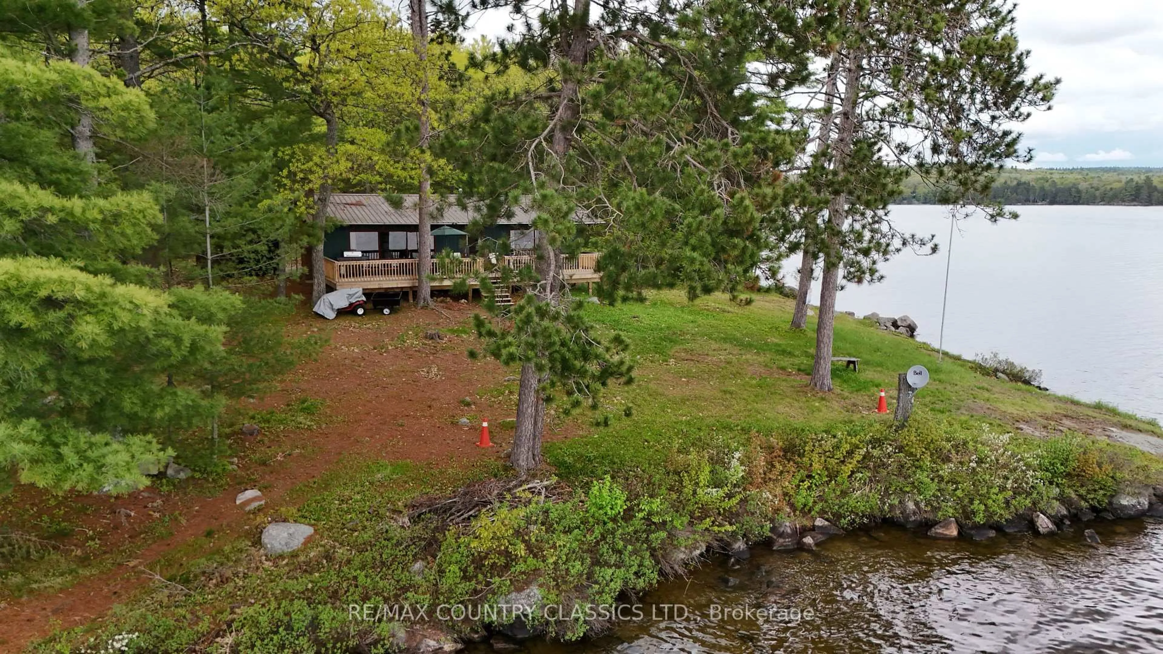 A pic from outside/outdoor area/front of a property/back of a property/a pic from drone, water/lake/river/ocean view for 910 Weslemkoon Lake, Addington Highlands Ontario K0L 2M0