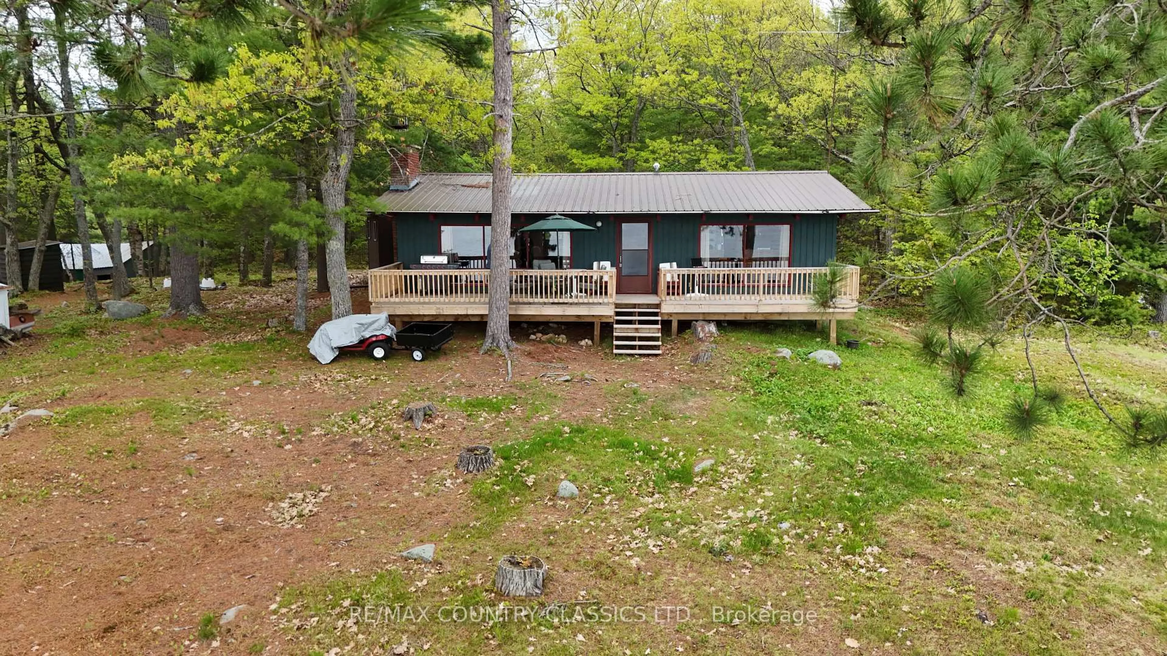 A pic from outside/outdoor area/front of a property/back of a property/a pic from drone, water/lake/river/ocean view for 910 Weslemkoon Lake, Addington Highlands Ontario K0L 2M0