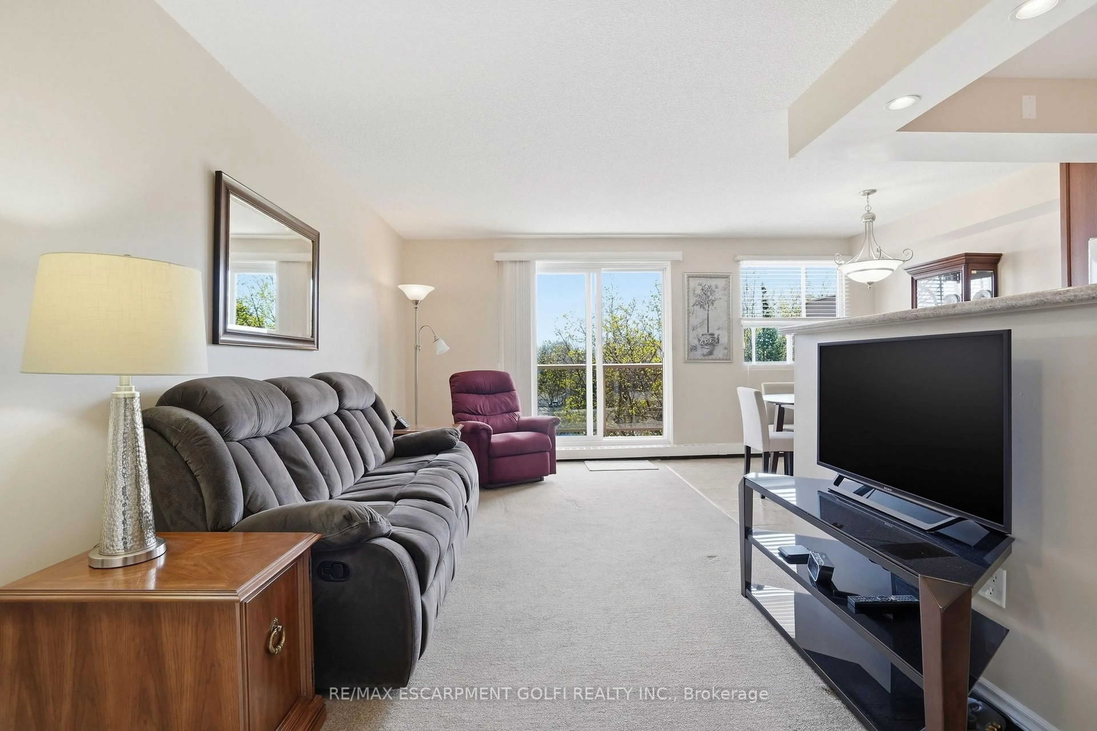 Living room with furniture, unknown for 793 Colborne St #512, Brantford Ontario N3S 7J3