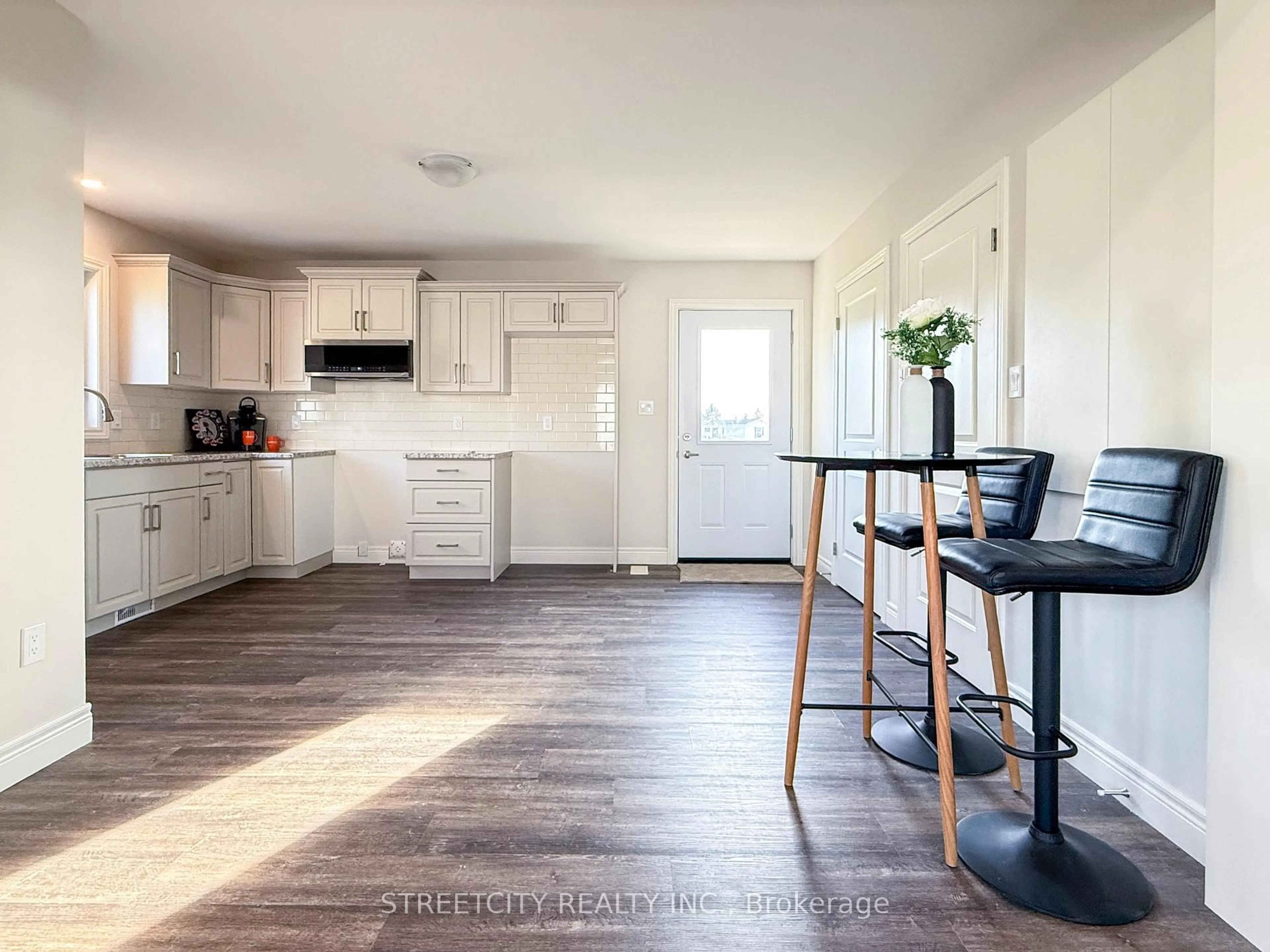 Open concept kitchen, wood/laminate floor for 2761 Oil Heritage Rd #25, Oil Springs Ontario N0N 1P0
