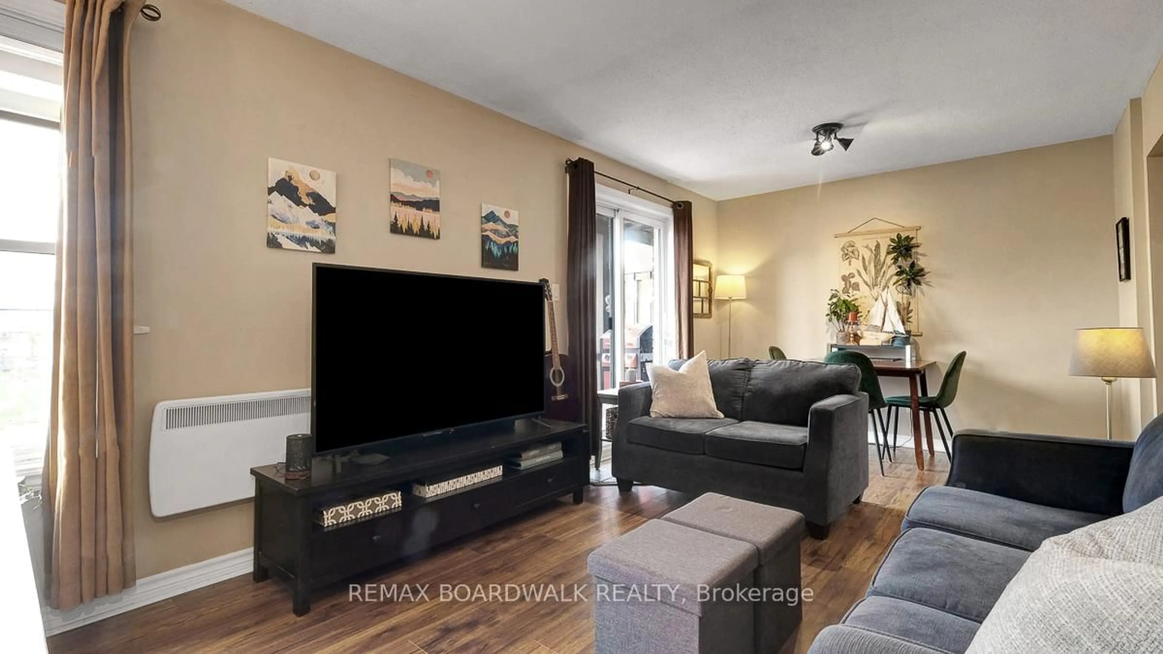 Living room with furniture, wood/laminate floor for 24 Townline Rd #105, Carleton Place Ontario K7C 4B6