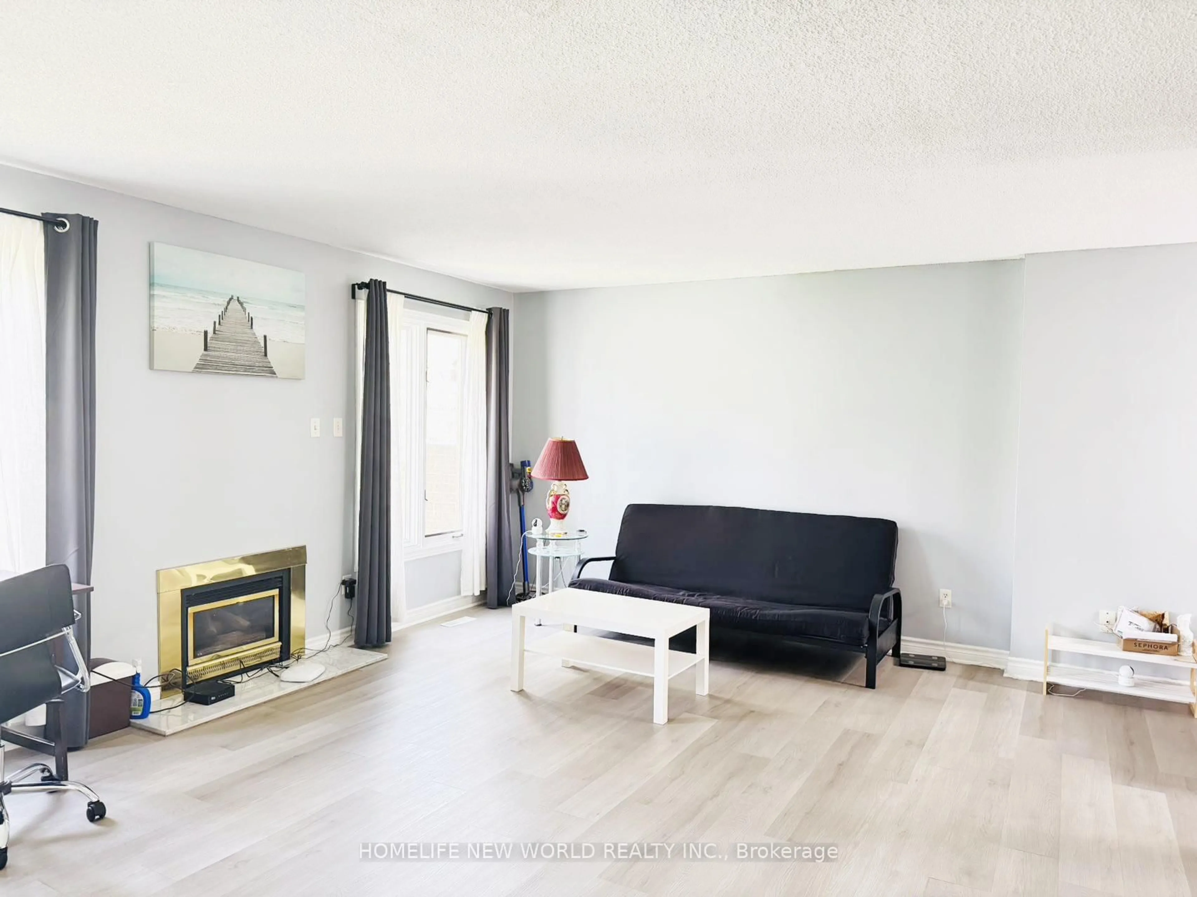 Living room with furniture, wood/laminate floor for 1500 Richmond St #79, London North Ontario N6G 4T8