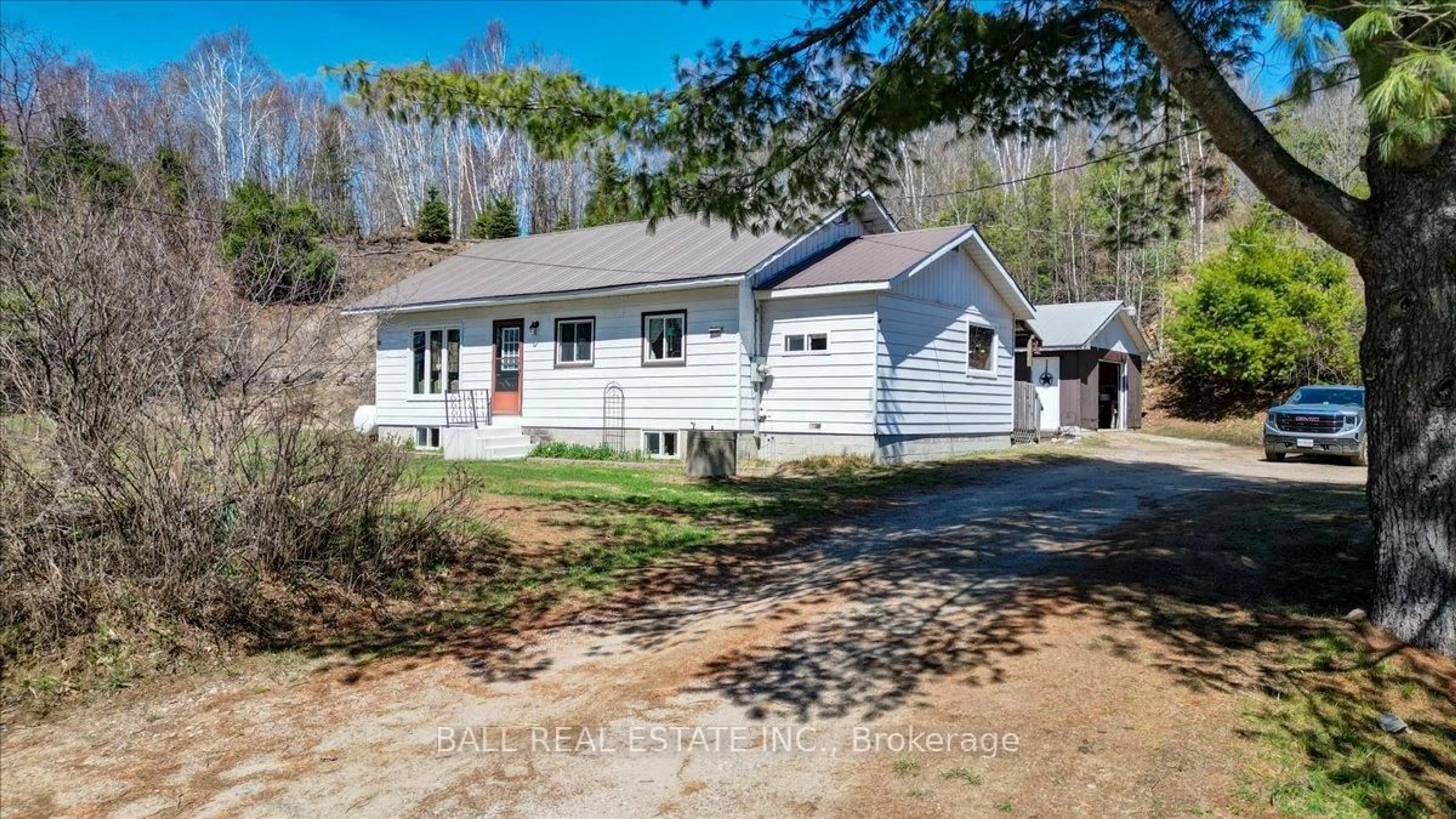 Home with vinyl exterior material, street for 202 Monck Rd, Bancroft Ontario K0L 1C0