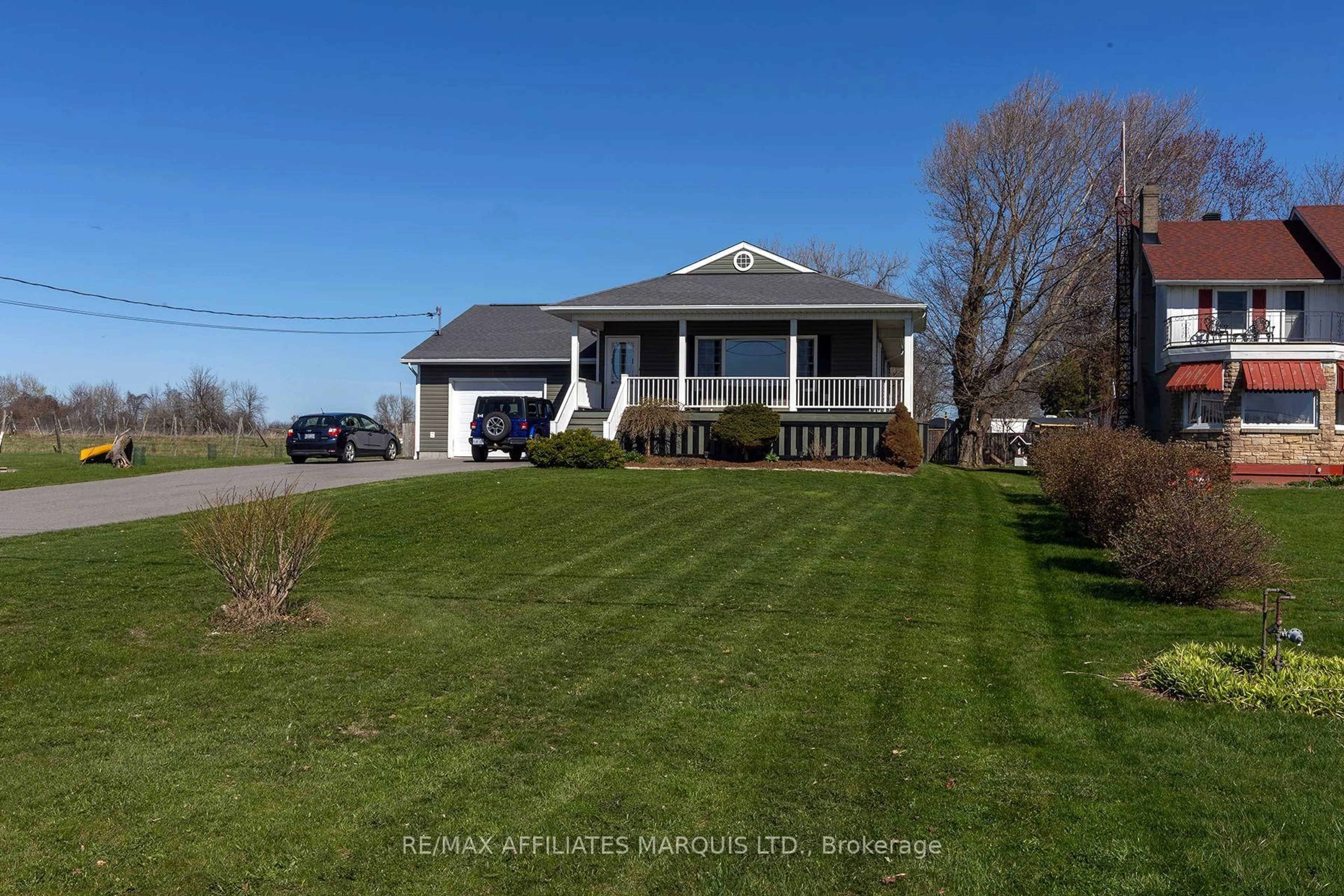 A pic from outside/outdoor area/front of a property/back of a property/a pic from drone, street for 11851 Lakeshore Dr, South Dundas Ontario K0C 1X0