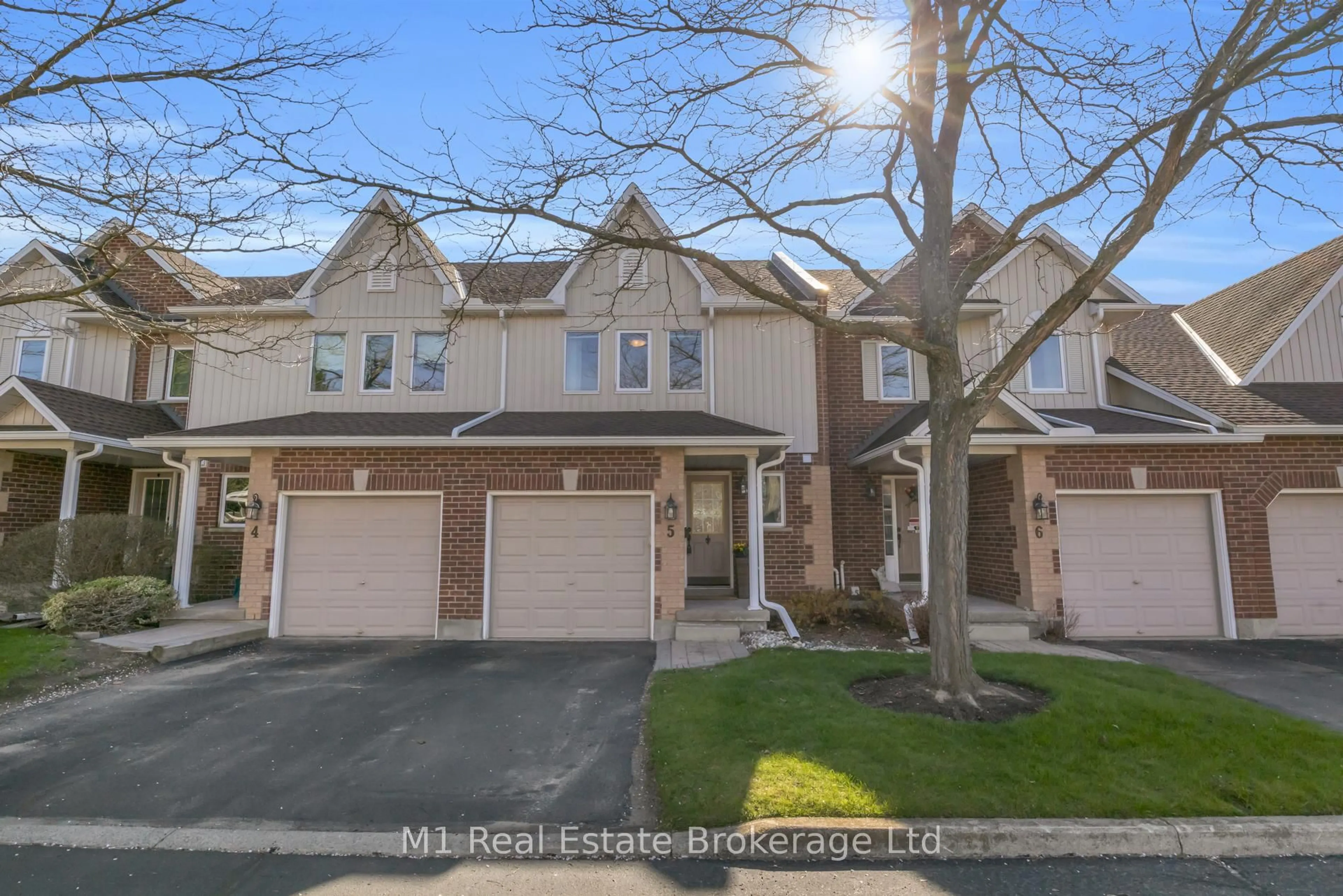 A pic from outside/outdoor area/front of a property/back of a property/a pic from drone, street for 39 Ptarmigan Dr #5, Guelph Ontario N1C 1E8