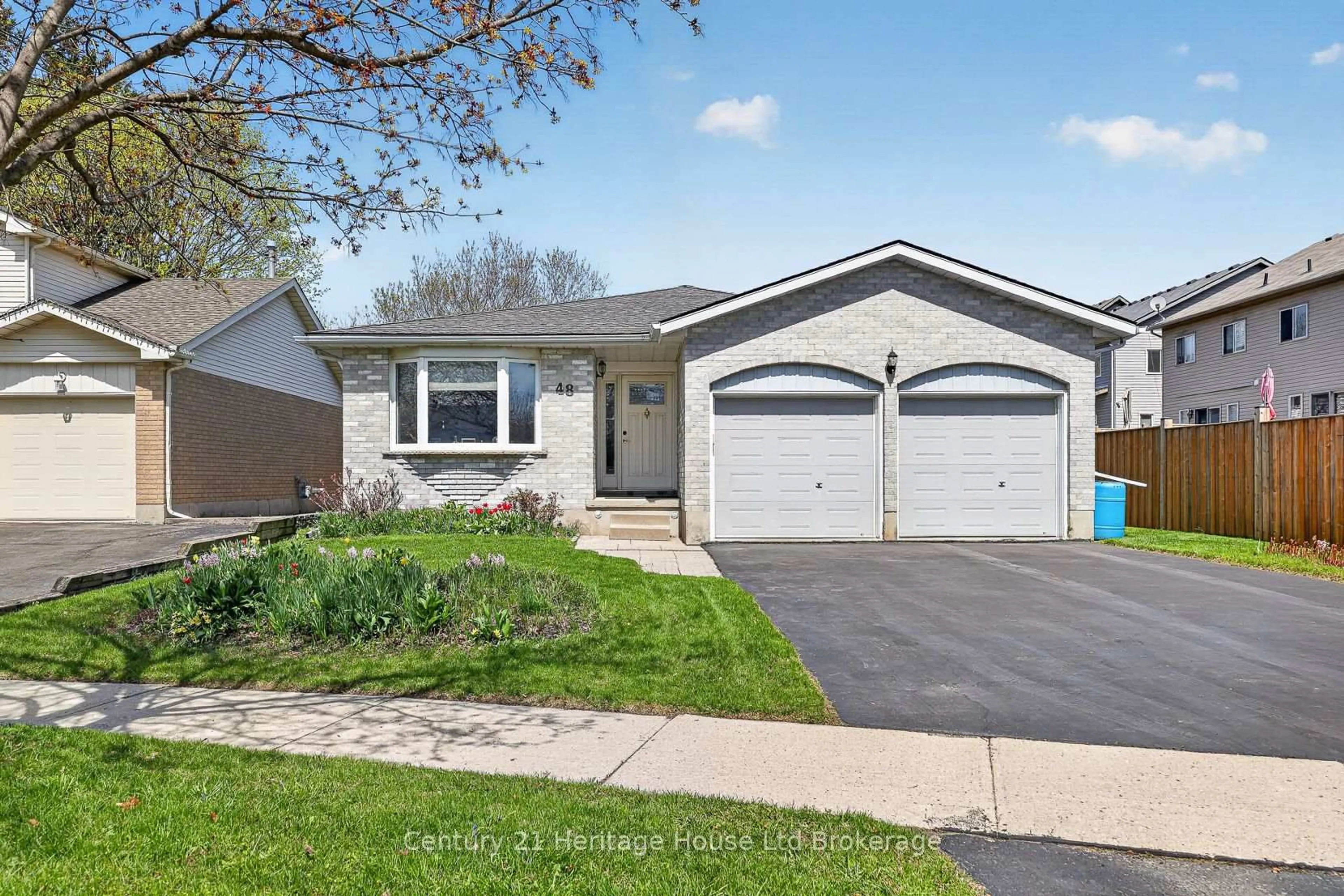 Home with vinyl exterior material, street for 48 Tagge St, Kitchener Ontario N2K 3R7