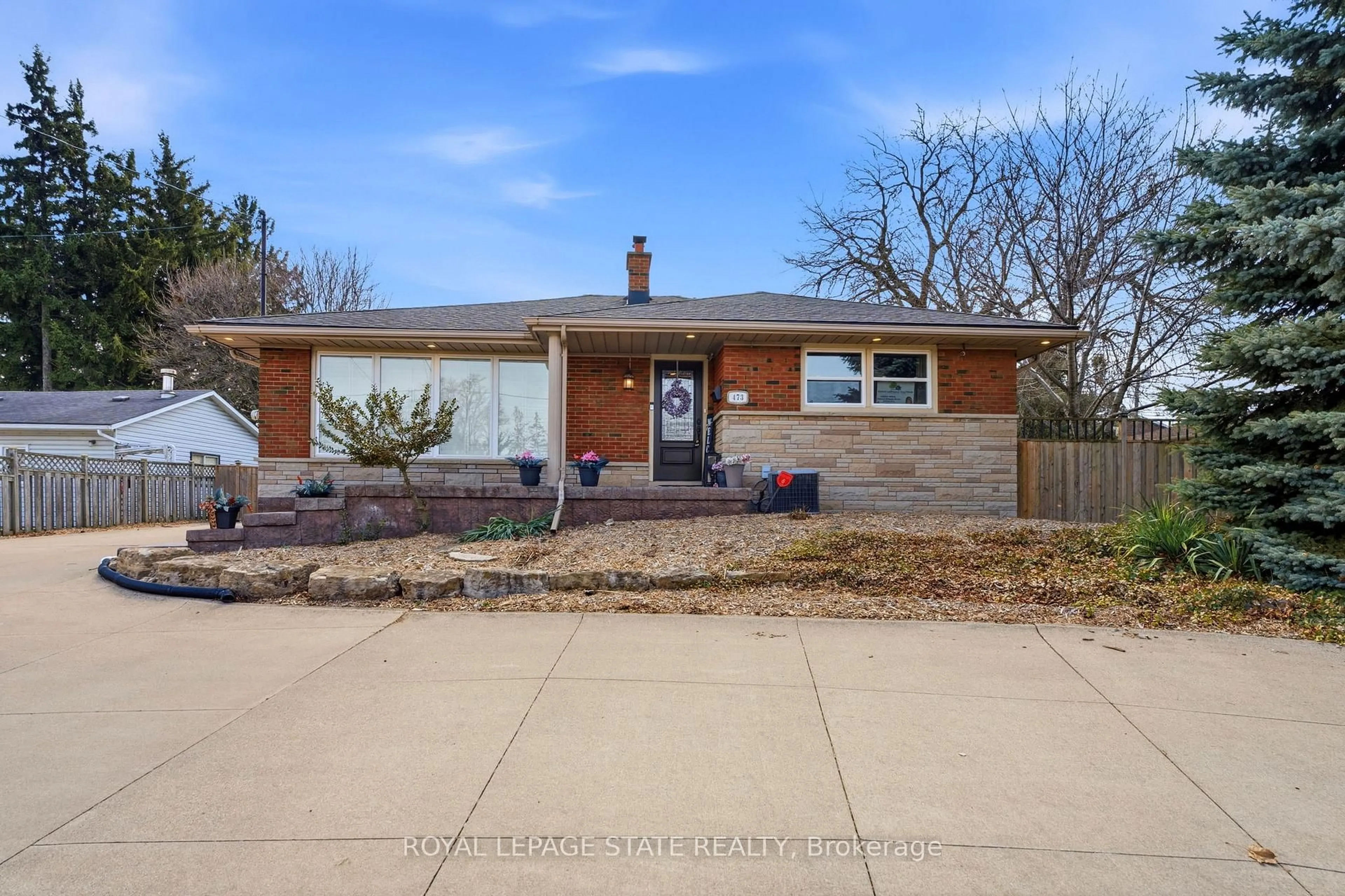 Home with brick exterior material, street for 473 Mohawk Rd, Hamilton Ontario L9C 1X3