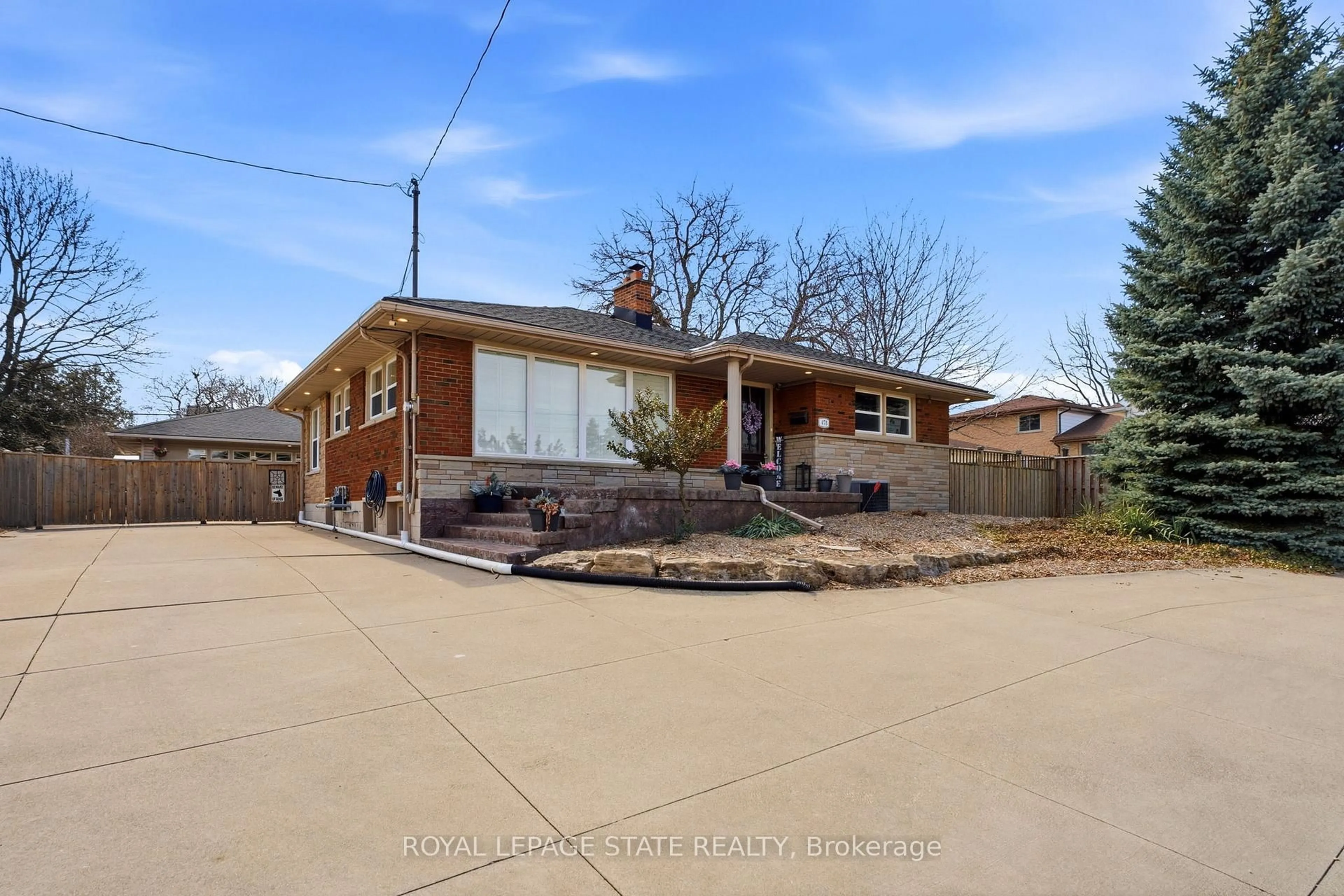 Home with brick exterior material, street for 473 Mohawk Rd, Hamilton Ontario L9C 1X3