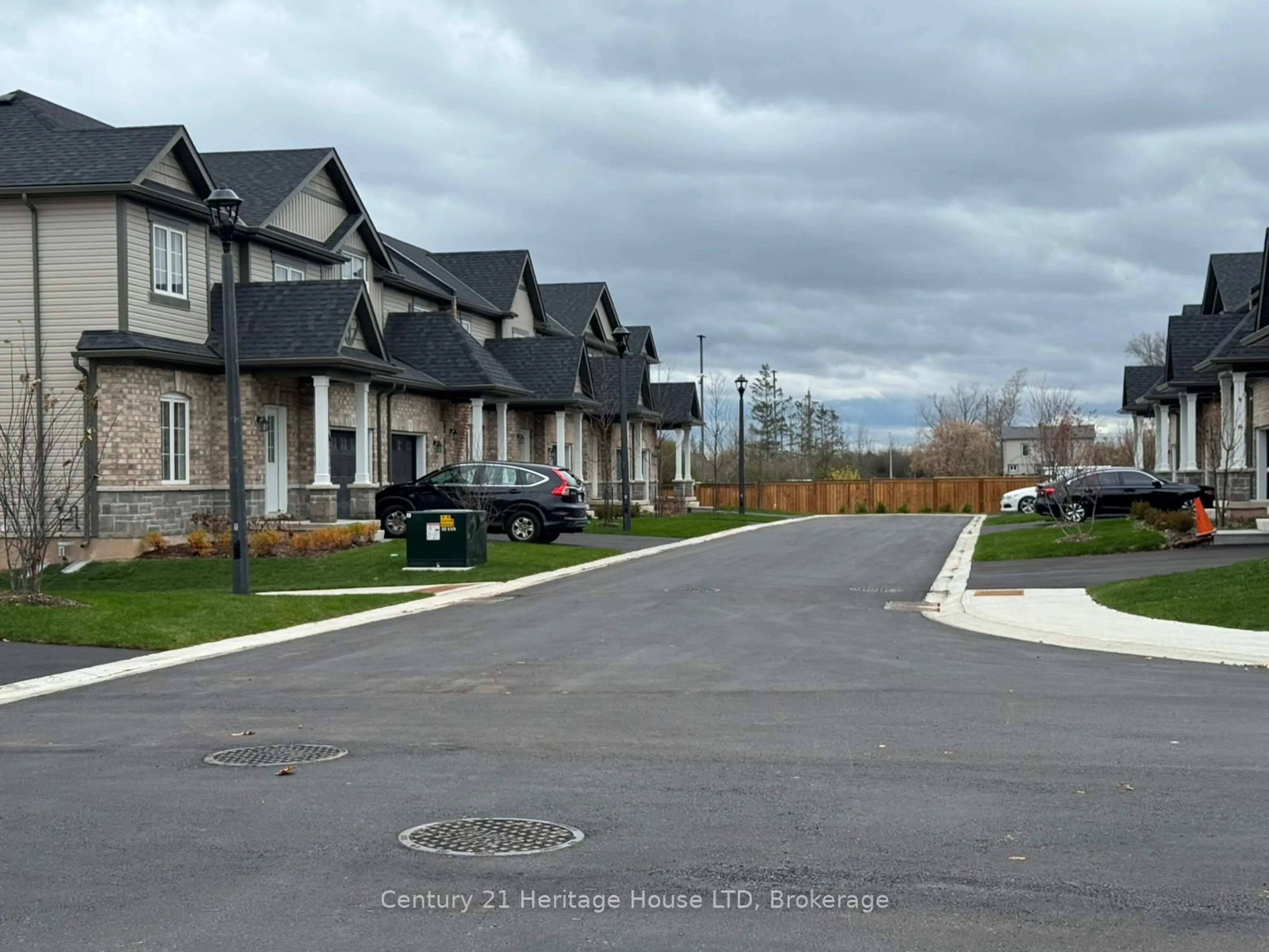 A pic from outside/outdoor area/front of a property/back of a property/a pic from drone, street for 397 Garrison Rd #13, Fort Erie Ontario L2A 1N1