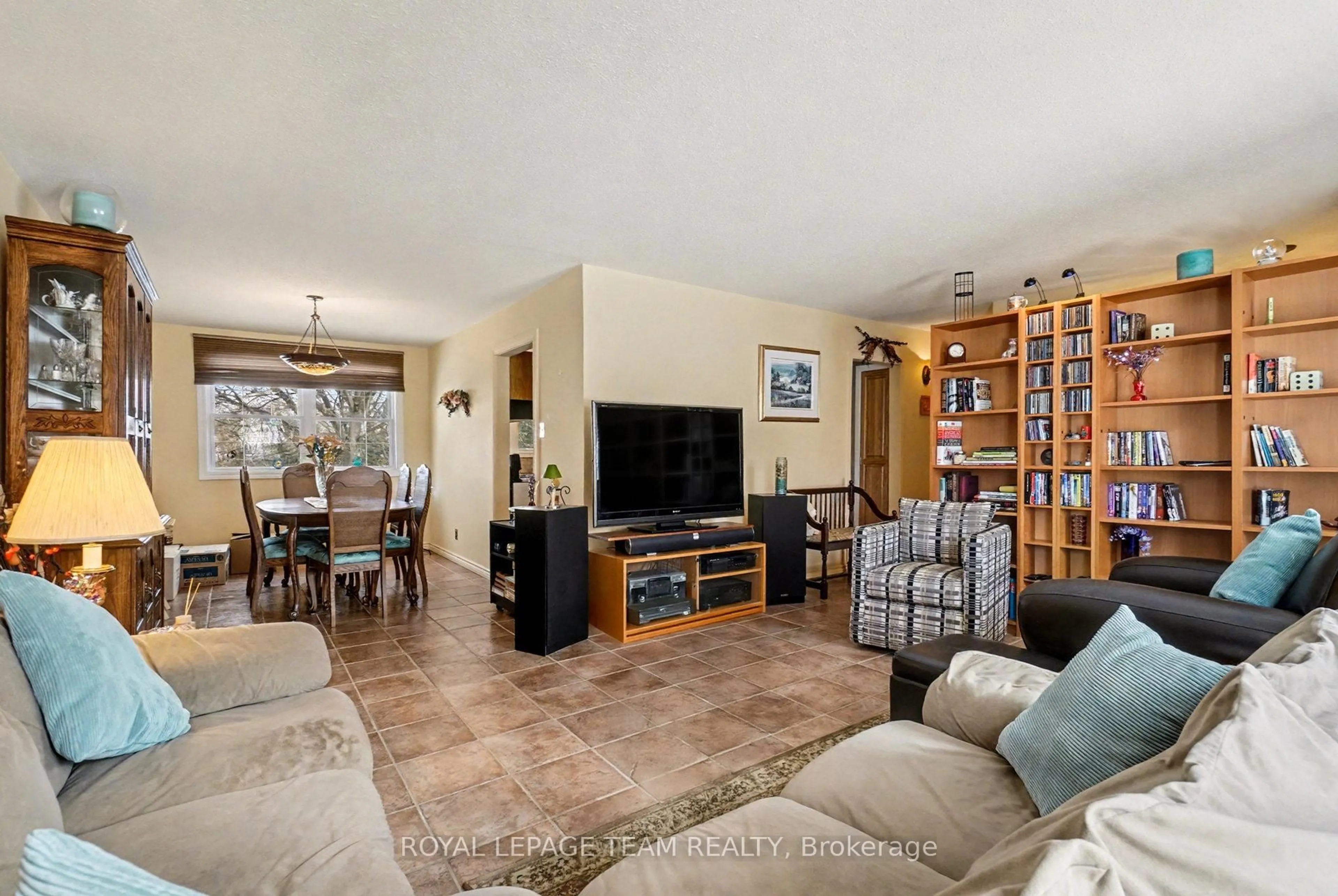 Living room with furniture, ceramic/tile floor for 30 Juniper Crt, Ottawa Ontario K2E 5M6