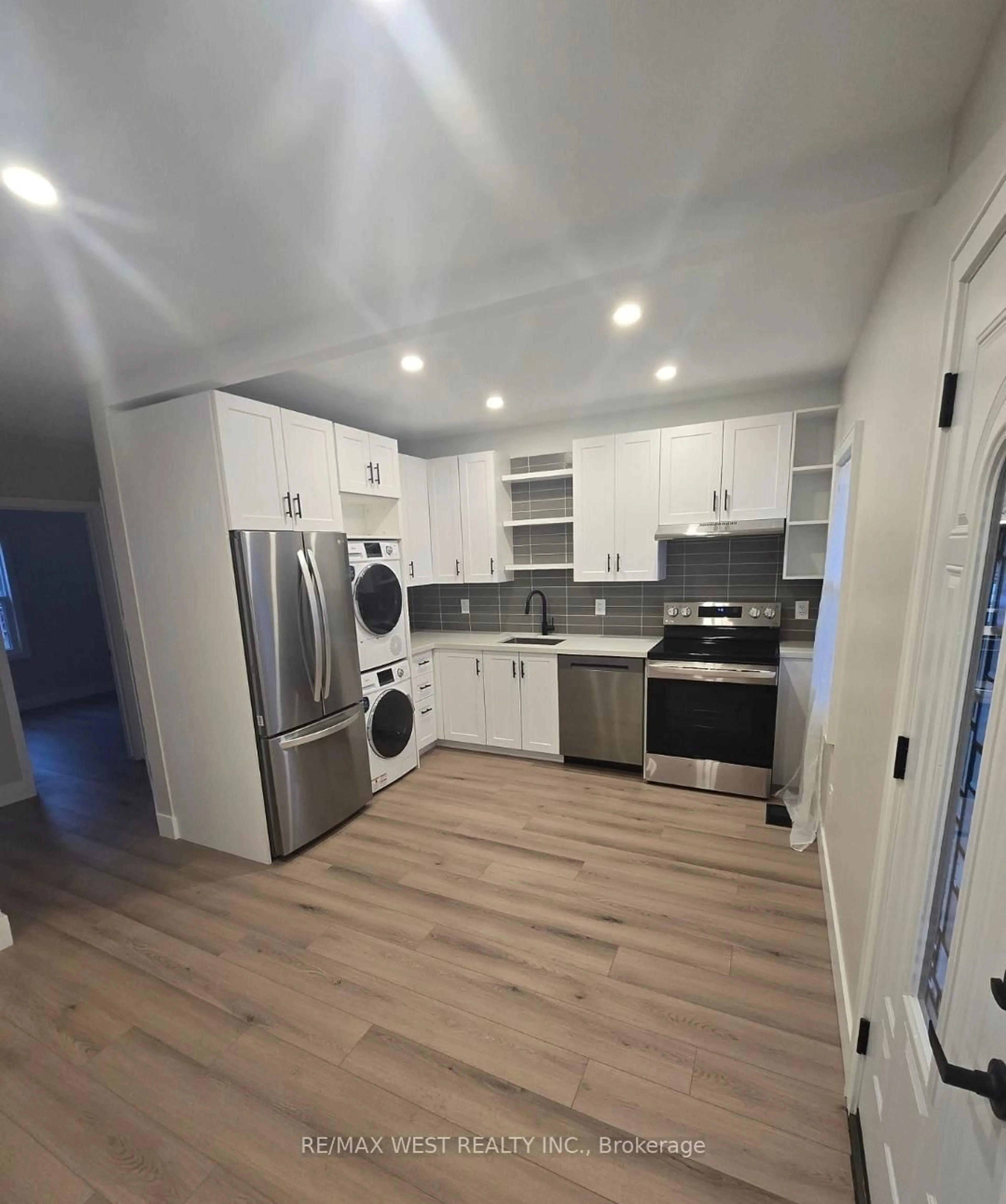 Open concept kitchen, wood/laminate floor for 413 Paling Ave, Hamilton Ontario L8H 5K3