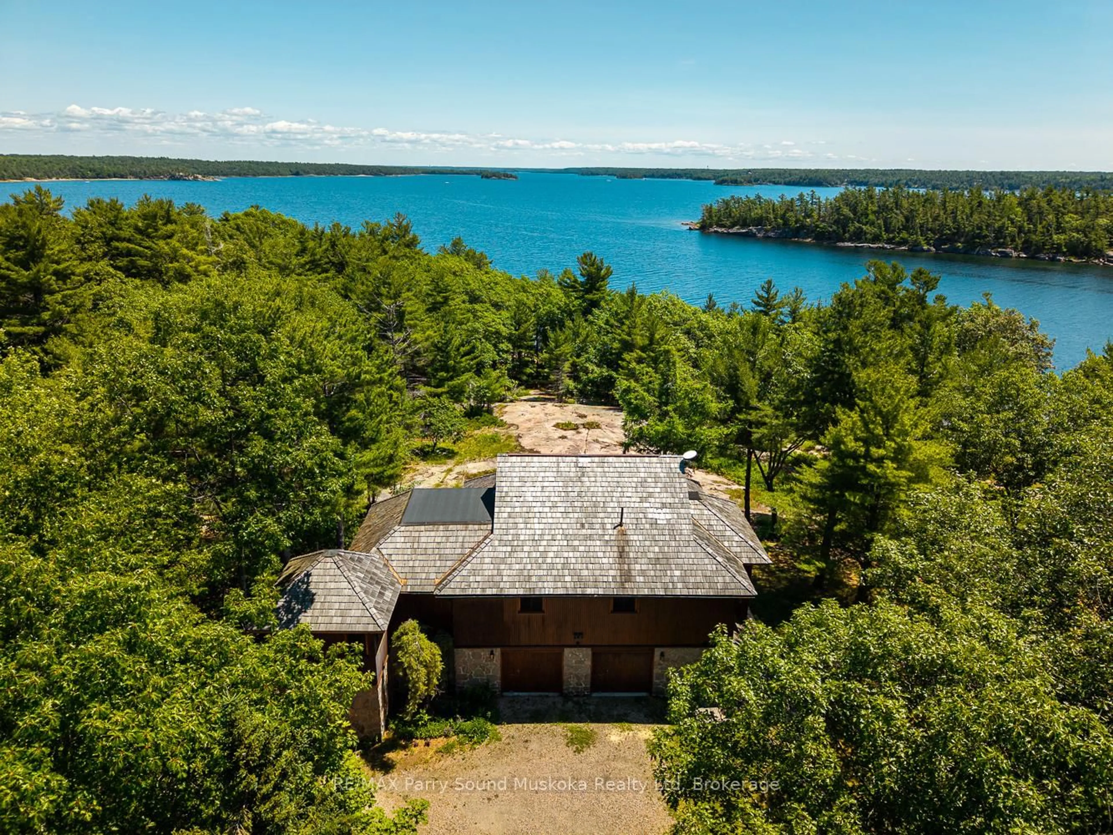 A pic from outside/outdoor area/front of a property/back of a property/a pic from drone, water/lake/river/ocean view for 47 Linda Lane, Carling Ontario P0G 1G0