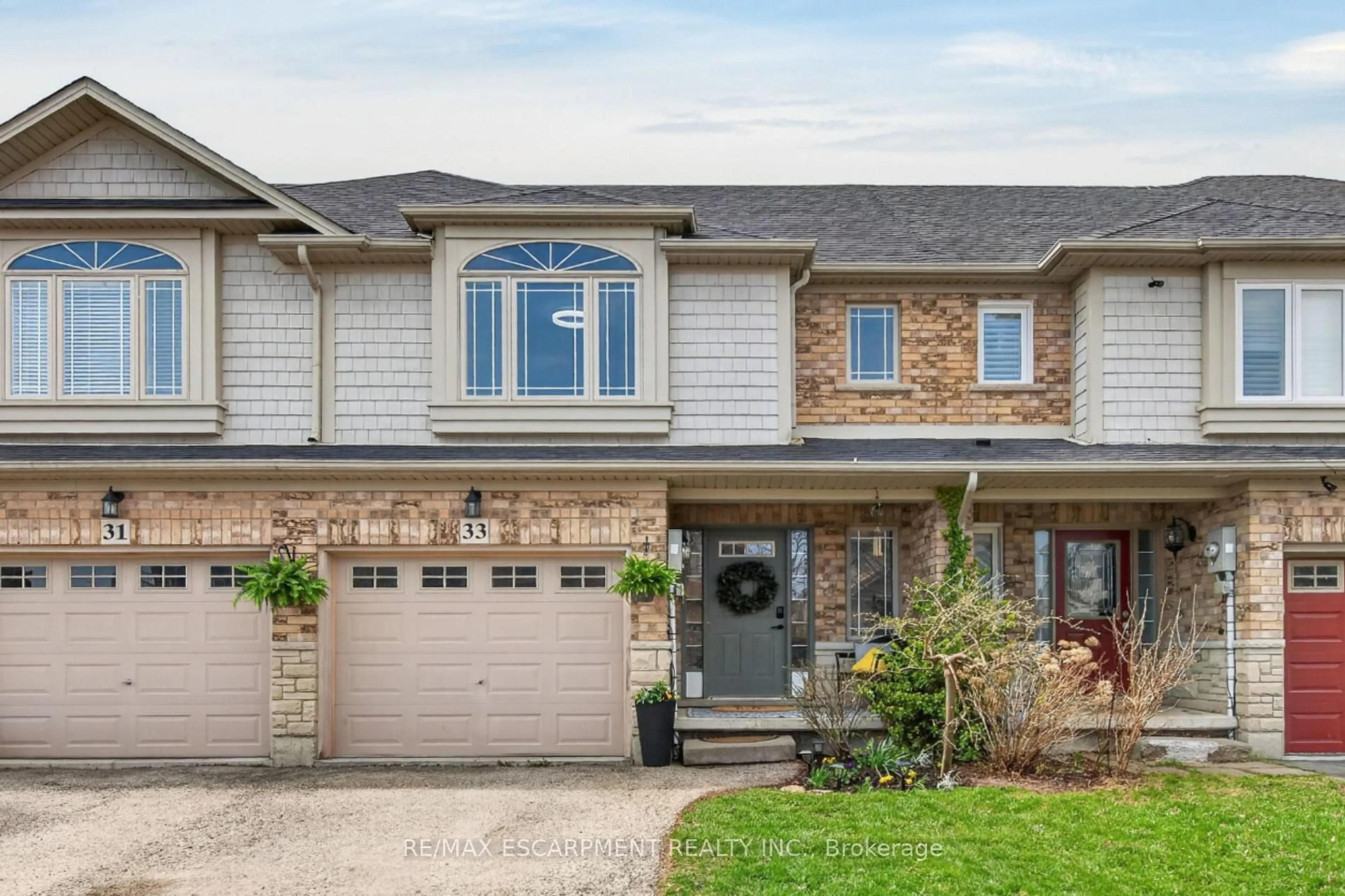 Home with brick exterior material, street for 33 Voyager Pass, Hamilton Ontario L0R 1C0