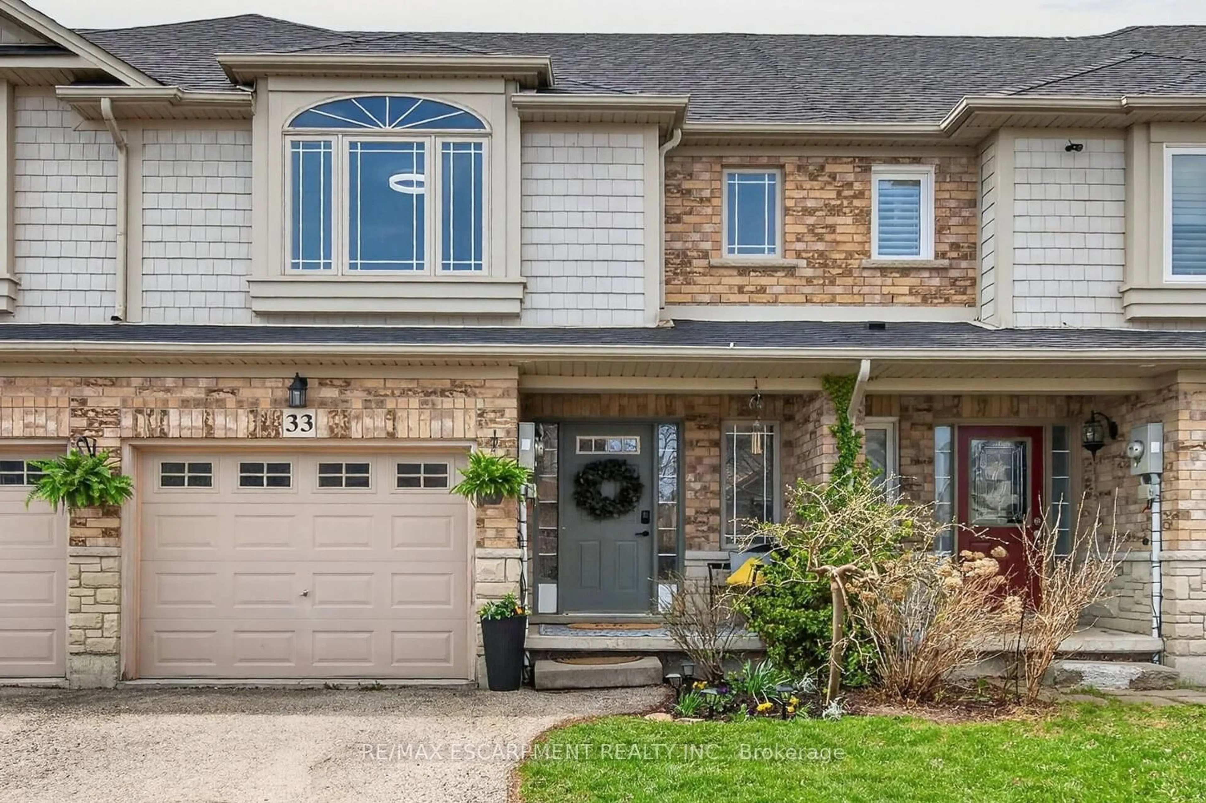 Home with brick exterior material, street for 33 Voyager Pass, Hamilton Ontario L0R 1C0