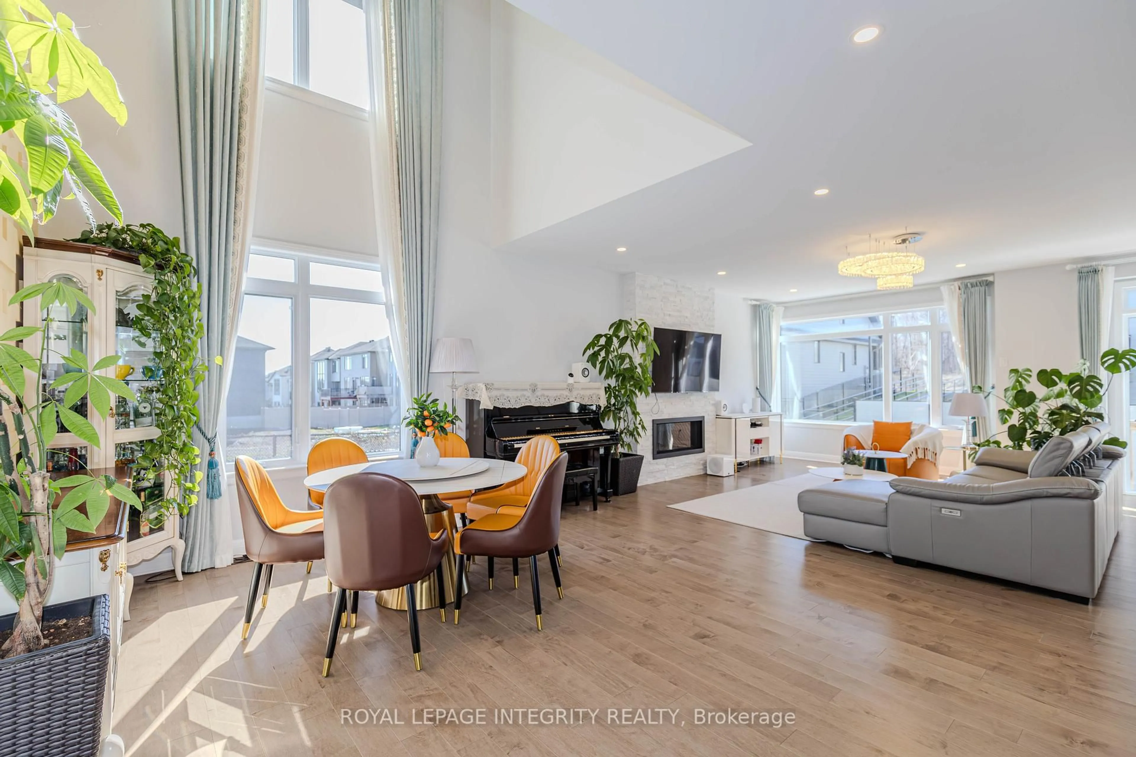 Living room with furniture, wood/laminate floor for 238 Ketchikan Cres, Ottawa Ontario K2T 0S3