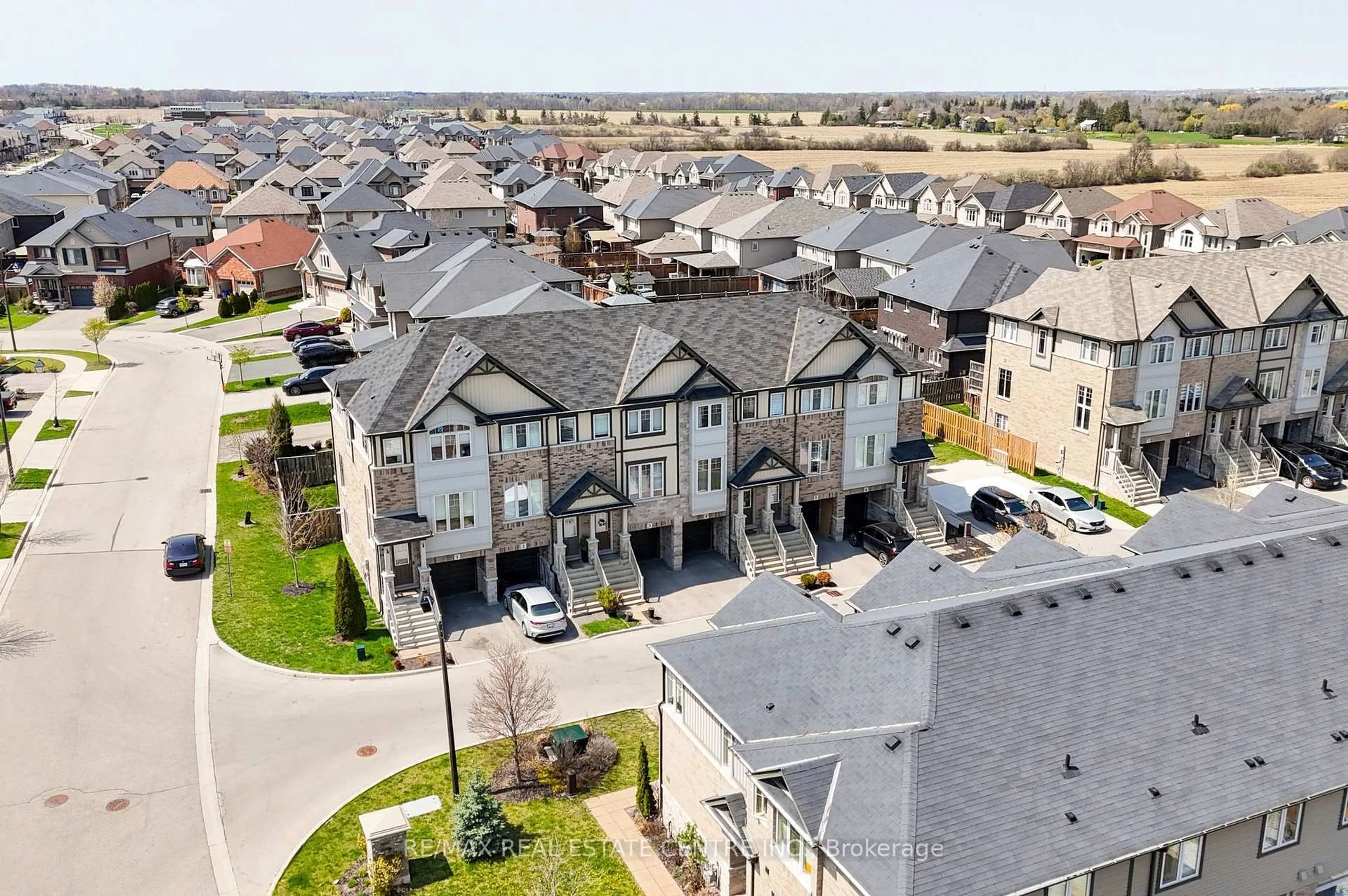 A pic from outside/outdoor area/front of a property/back of a property/a pic from drone, street for 247 Festival Way #4, Hamilton Ontario L0R 1C0