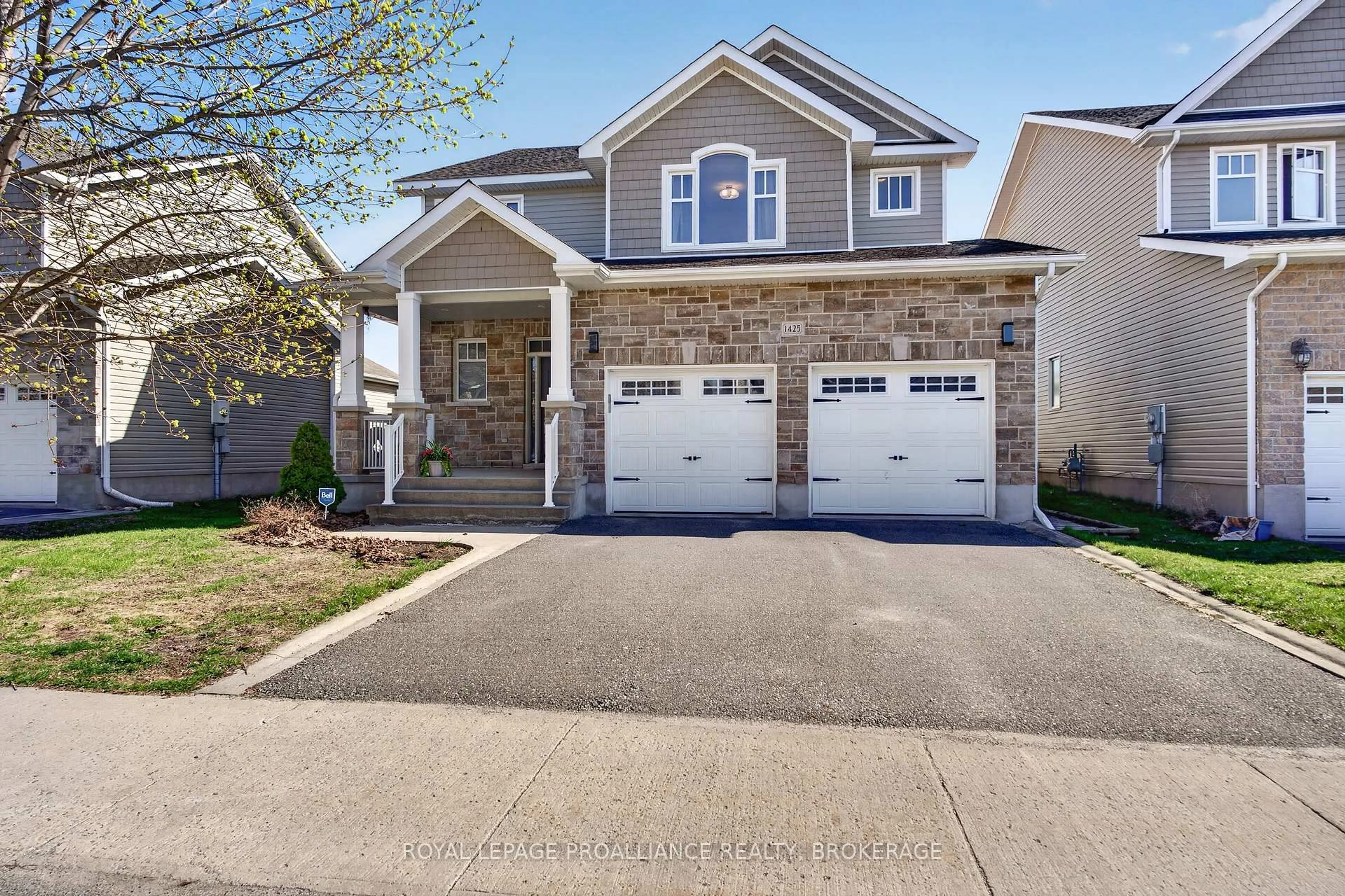 Home with vinyl exterior material, street for 1425 Evergreen Dr, Kingston Ontario K7P 0H5