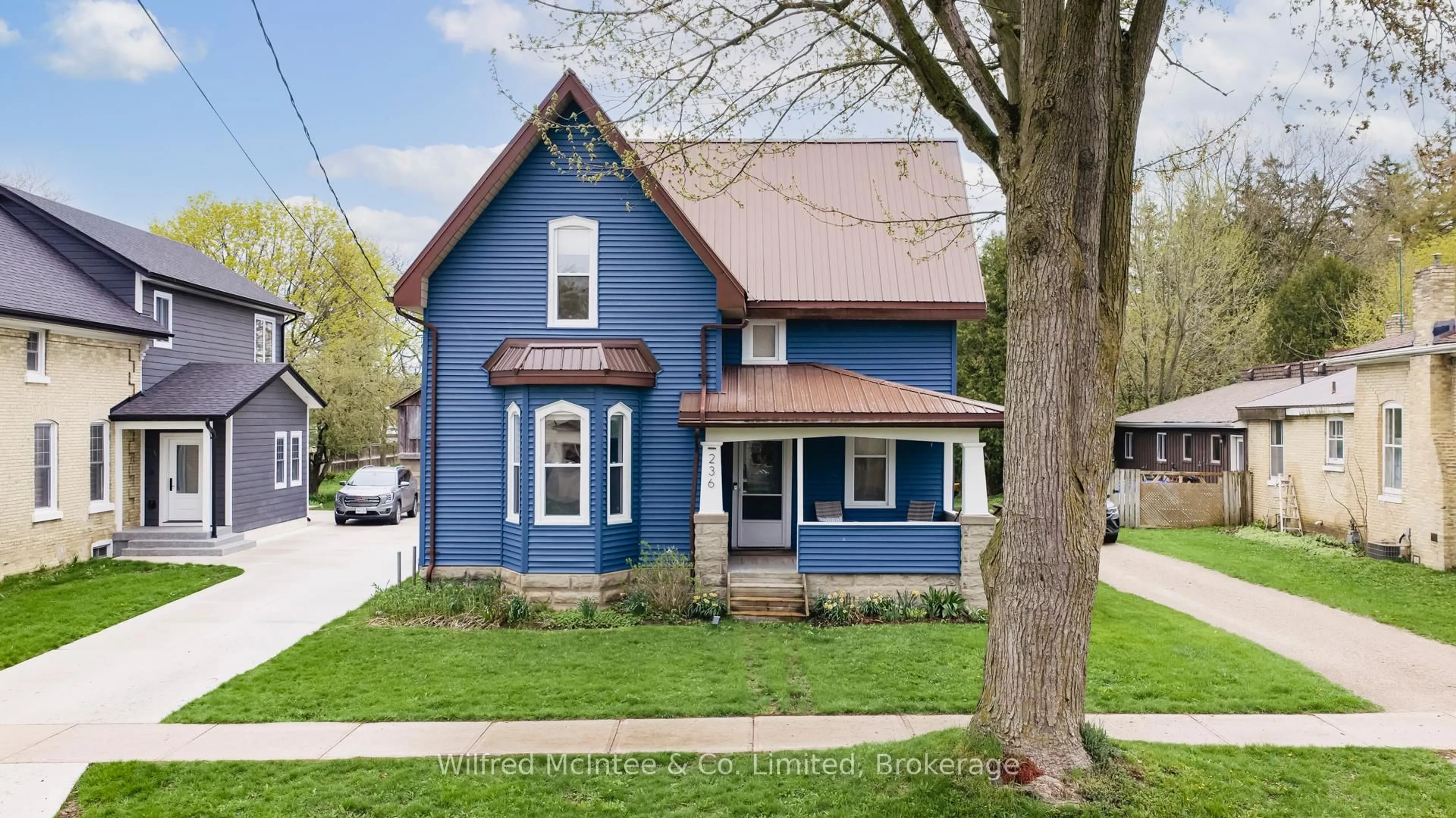 Home with vinyl exterior material, street for 236 Andrew St, South Huron Ontario N0M 1S1